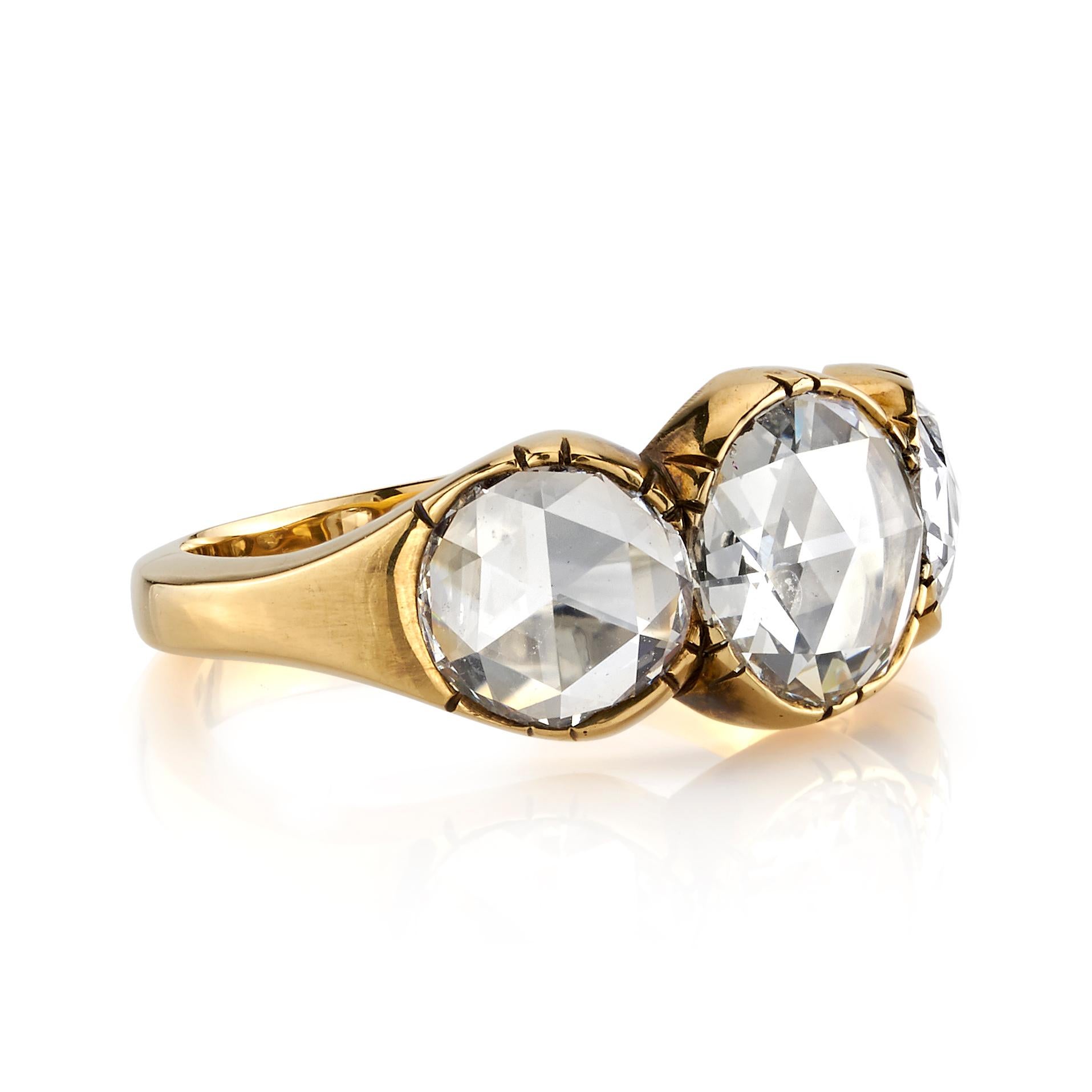 2.55ctw FGK/VVS1-VS2 GIA certified Rose cut diamonds set in a handcrafted 18K oxidized yellow gold three stone mounting. Ring is currently a size 6 and can be sized to fit. 