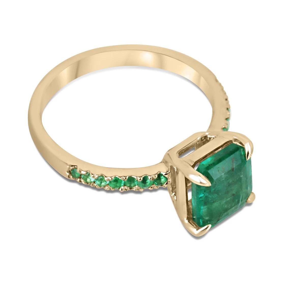 This is a one-of-a-kind, all-emerald solitaire with accents engagement or right-hand ring. This piece features a stunning 2.15-carat natural emerald that is emerald cut, with a rich, lush green color that is sure to capture attention. The emerald is