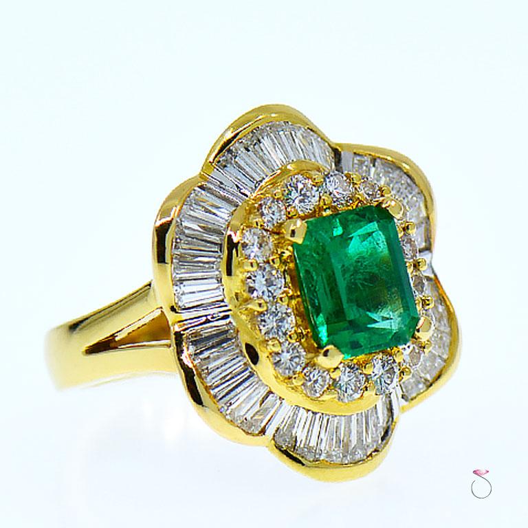 Beautiful Natural Colombian Emerald & Diamond Ballerina ring. This ring features an approximately 2.56 carat natural rectangular shape Colombian Emerald in the center surrounded by a beautiful double diamond halo. The inner halo is set with 16 round