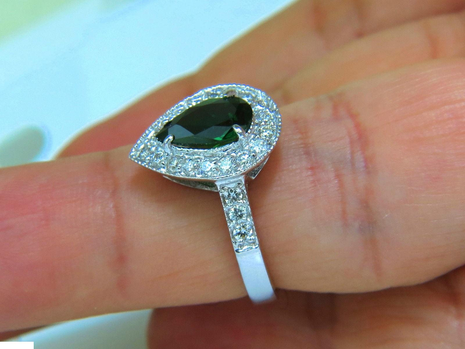1.56ct. Intense Brilliant & Fine green 
Natural tsavorite

Amazing Pear cut

Very Very Clean Clarity

Beautiful Green sparkles throughout

The classic Tsavorite color

Transparency A+

6mm diameter

9.8 X 6.3mm



Side diamonds total: