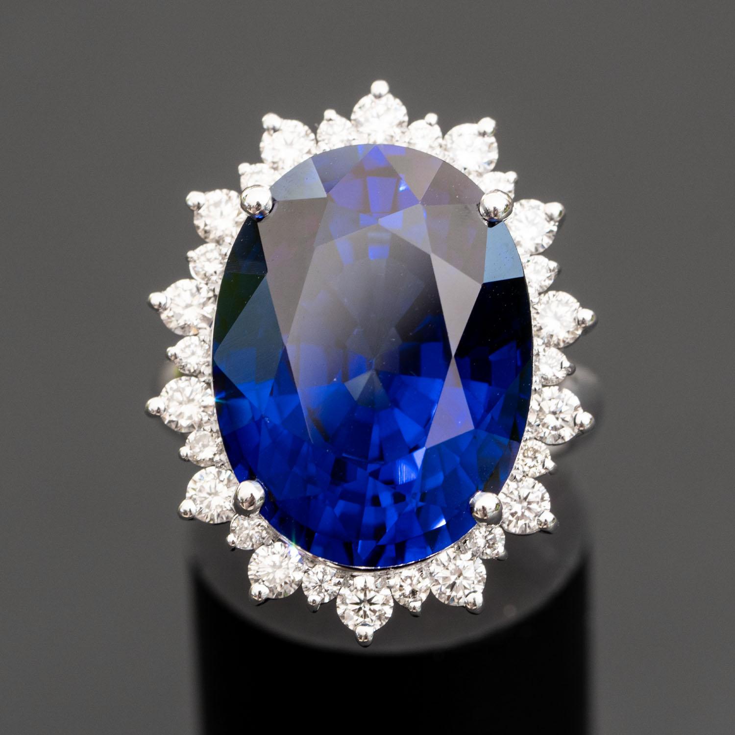 This gorgeous blue sapphire ring will impress everyone around you. It features a large oval 25.60 carat gemstone, adorned with 1.30 carat natural diamonds.

Diffused Sapphire
Shape: Oval Sapphire                                                      