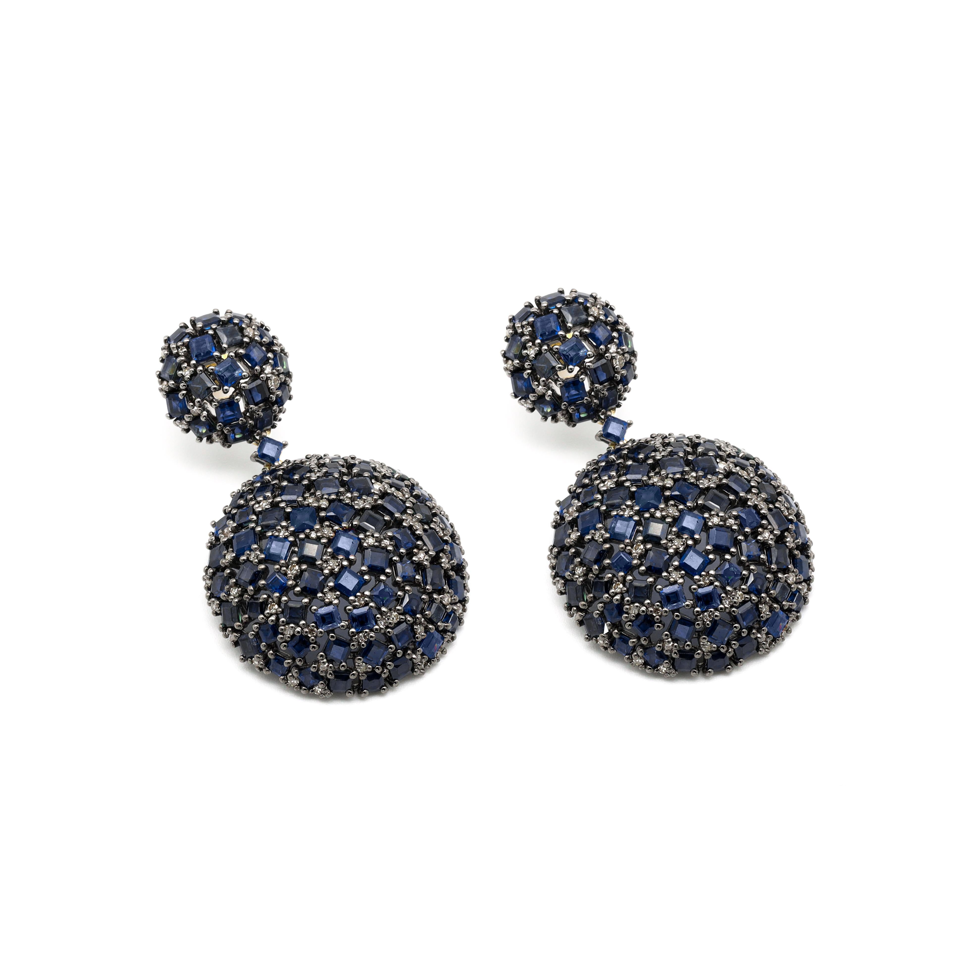 25.63 Carat Sapphire and Diamond Cocktail Drop Earrings in Art-Deco Style

This Victorian-era art-deco style exquisite prussian blue sapphire and diamond semi-circle style earring is impressive. The mixed-size collection of square-cut sapphires are