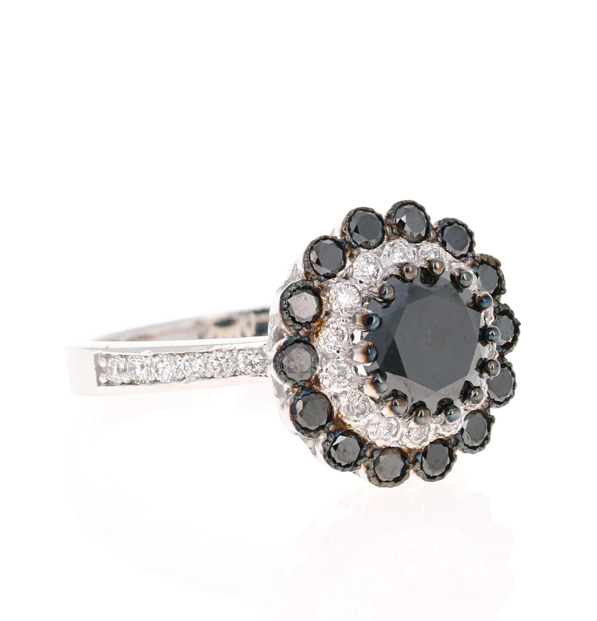 This Black and White Diamond Ring is the most unique and beautiful Engagement Ring!

The Round Cut Black Diamond is 1.69 Carats and its gorgeous setting holds 14 Black Round Cut Diamonds weighing 0.54 Carats and 26 Round Cut Diamonds that weigh 0.34