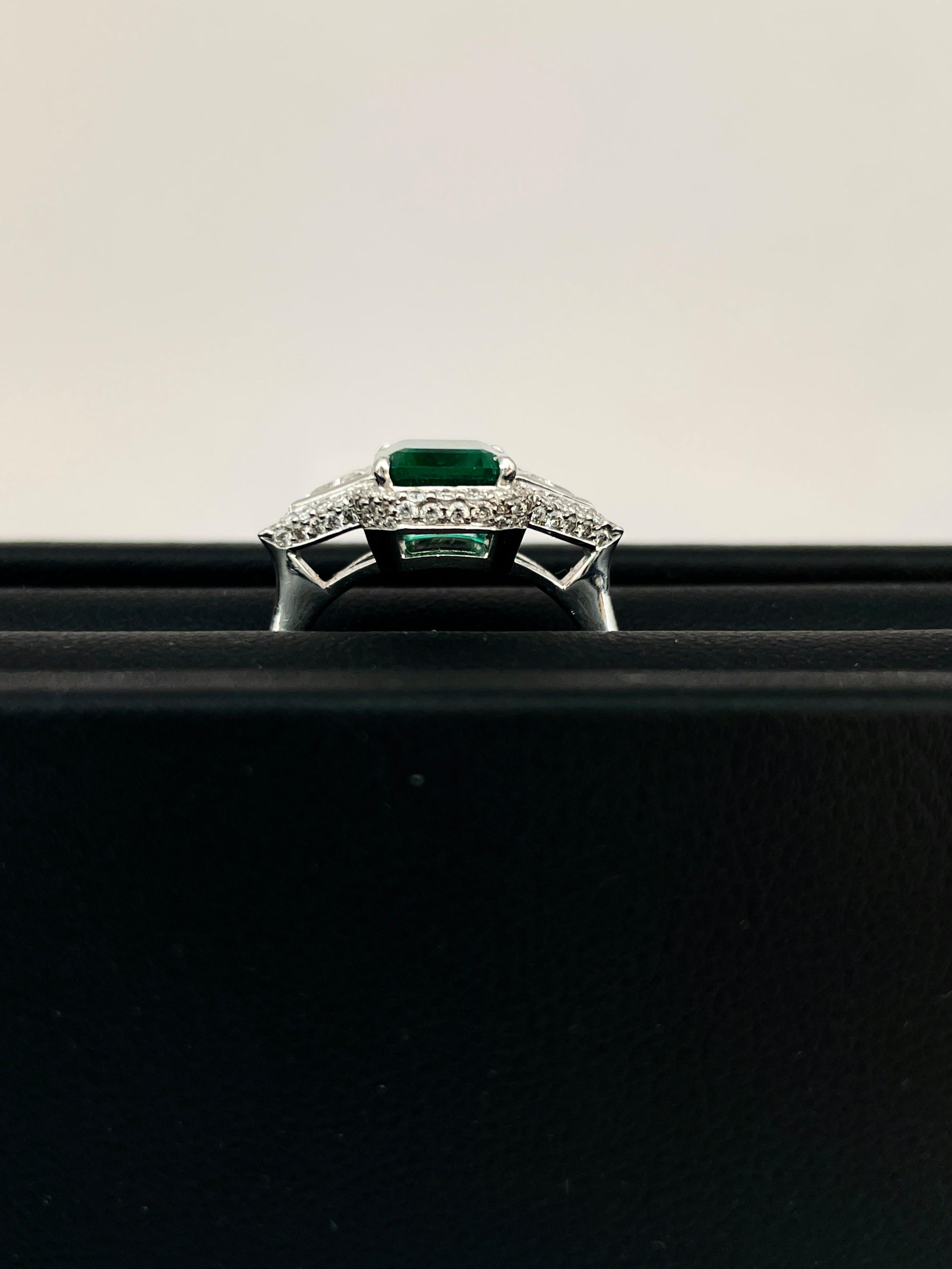 Emerald Cut AGL Certified 2.57 Carat Emerald Three Stone Halo Ring For Sale