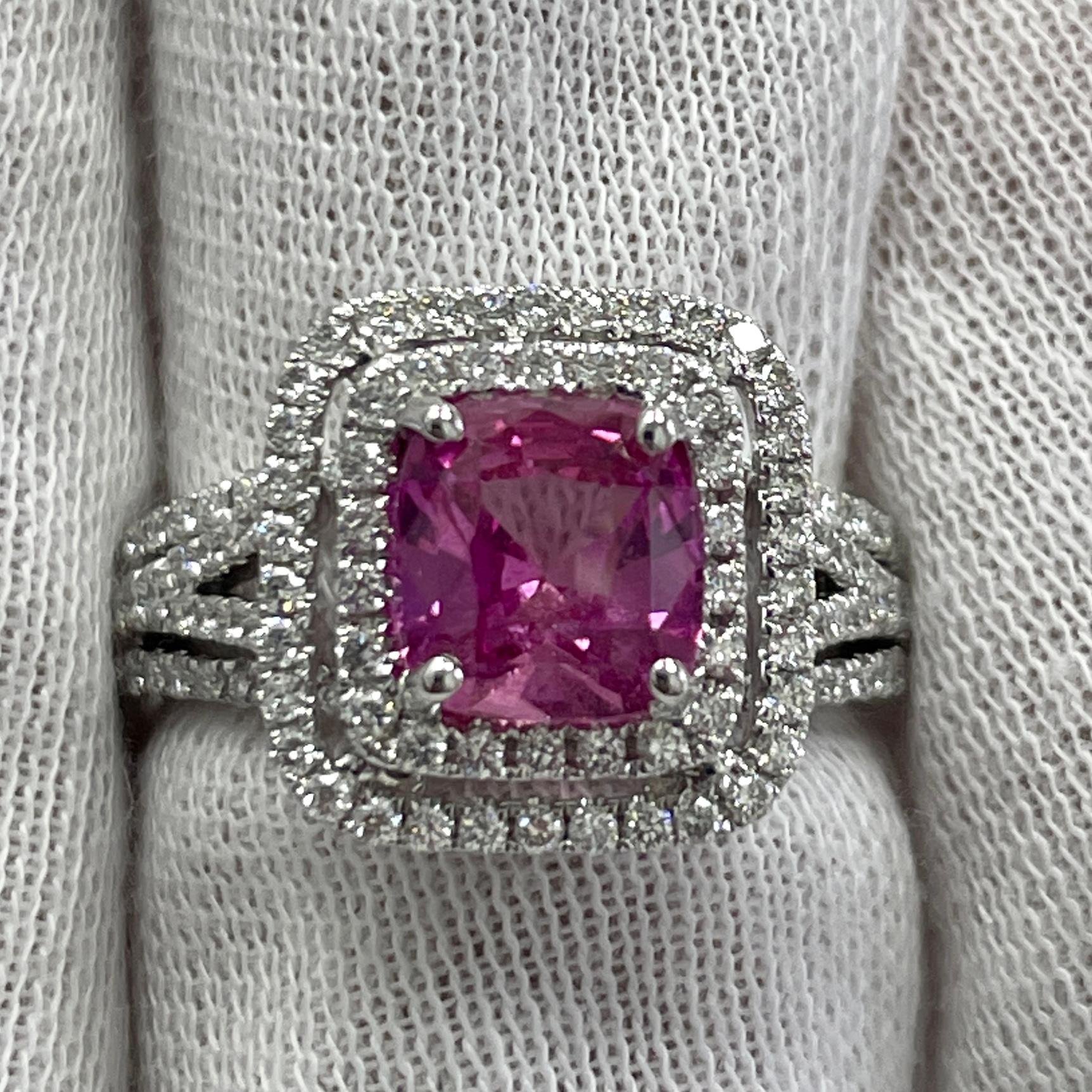 This is a STUNNING pink sapphire, mounted in an elegant 18K white gold and diamond ring with 0.74Ct of brilliant white diamonds. Suitable for any occasion!