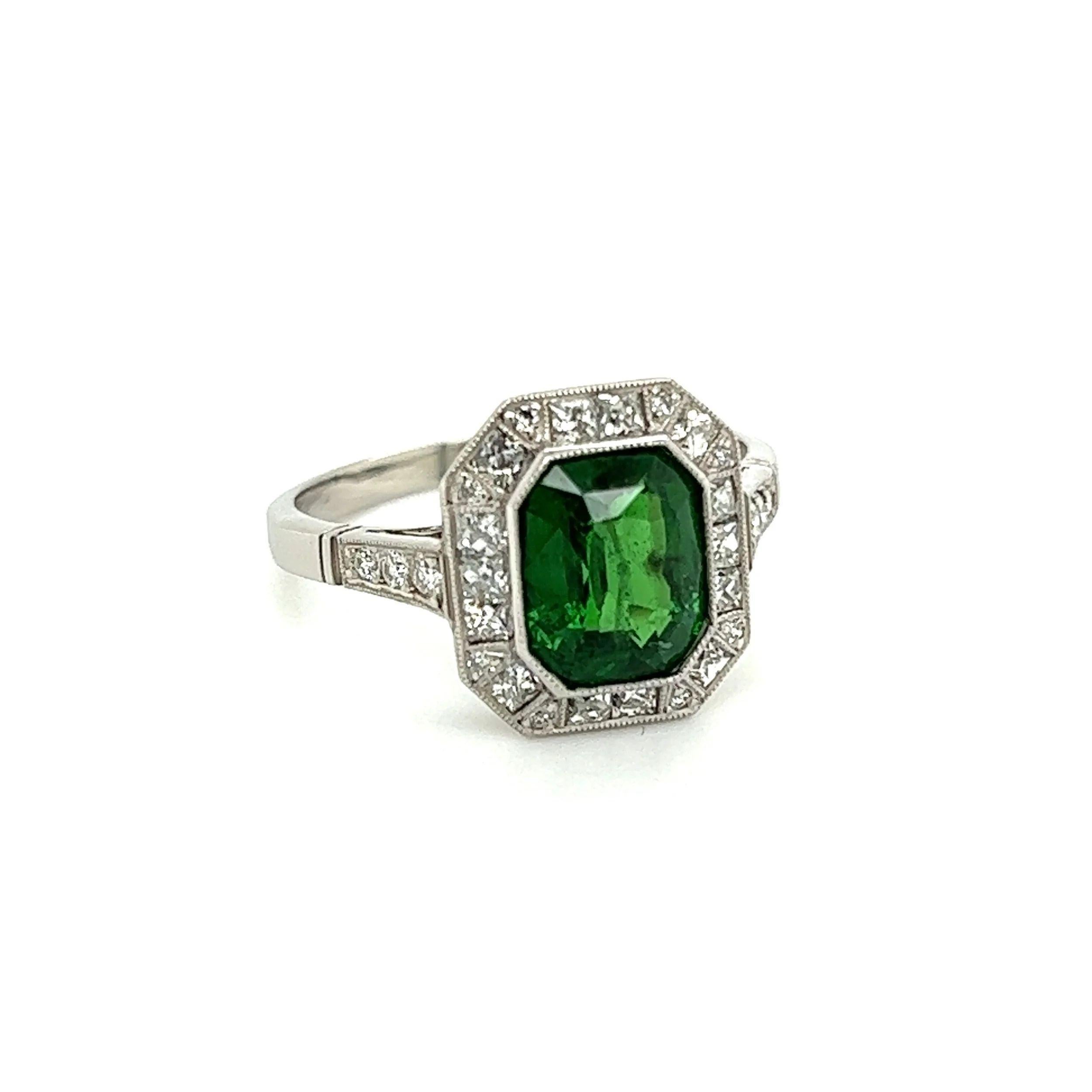 Simply Beautiful! Finely detailed Emerald Cut Tsavorite Garnet and Diamond Platinum Vintage Cocktail Ring. Centering a securely nestled Emerald-Cut Tsavorite Garnet, weighing approx. 2.57 Carats. Surrounded by Diamonds, 0.50tcw French and 0.20tcw