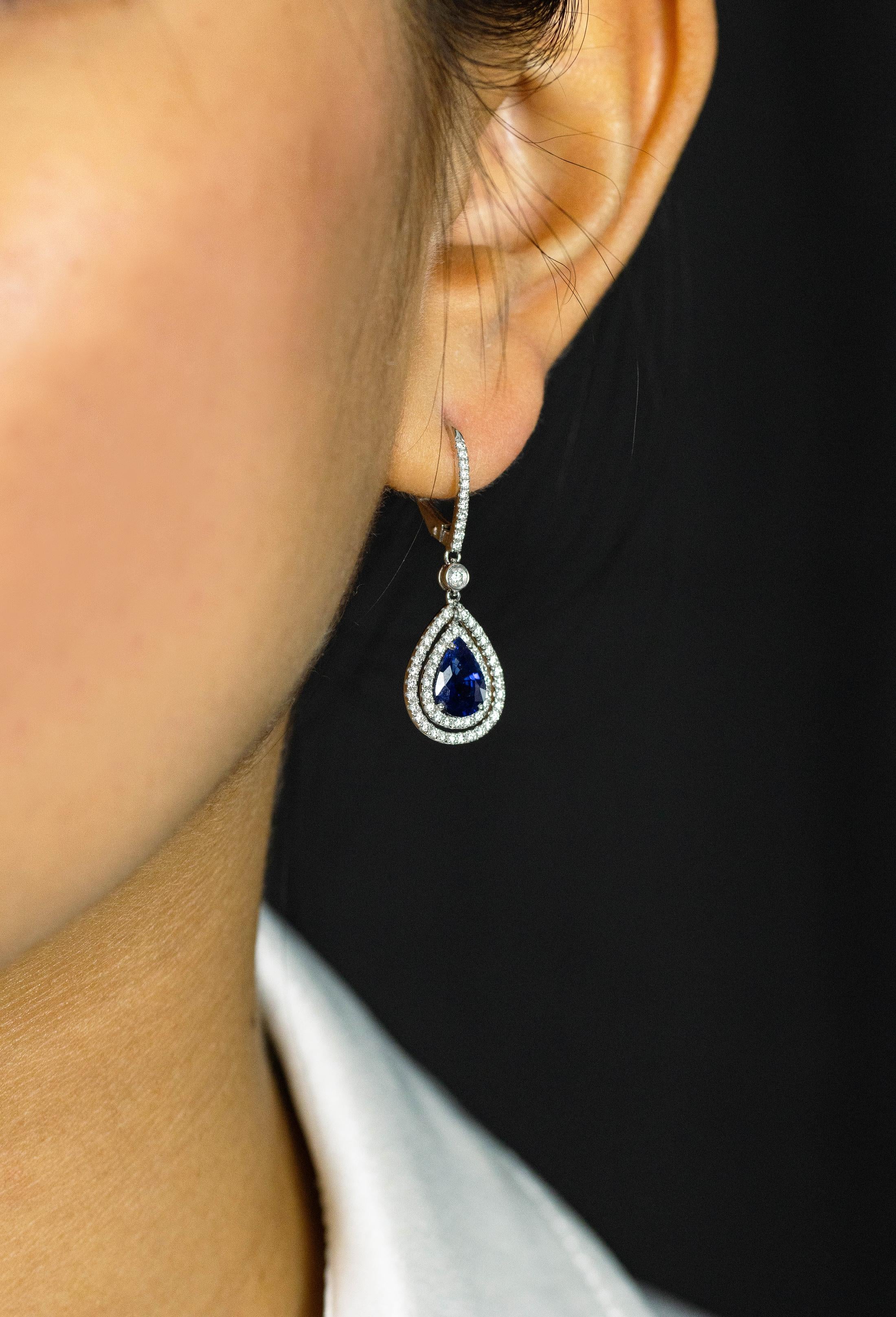 Showcasing pear shape sapphires surrounded by two rows of round brilliant diamonds in an open-work design and suspended on an accented lever-back made in 18K white gold. Sapphires weigh 2.57 carats total; diamonds weigh 0.69 carats total.

Roman