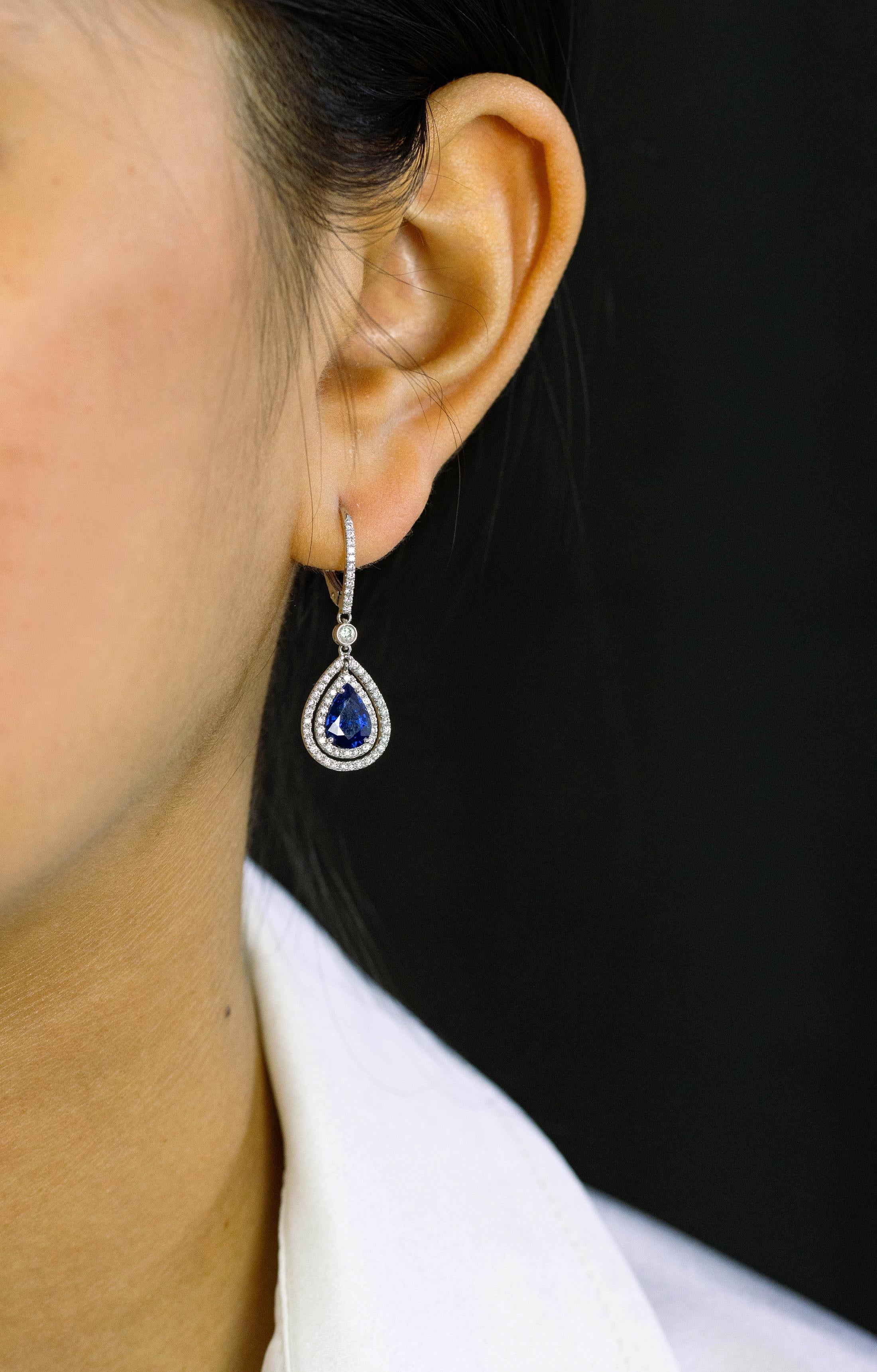 Contemporary 2.57 Carats Pear Shape Blue Sapphire with Diamond Double Halo Dangle Earrings For Sale