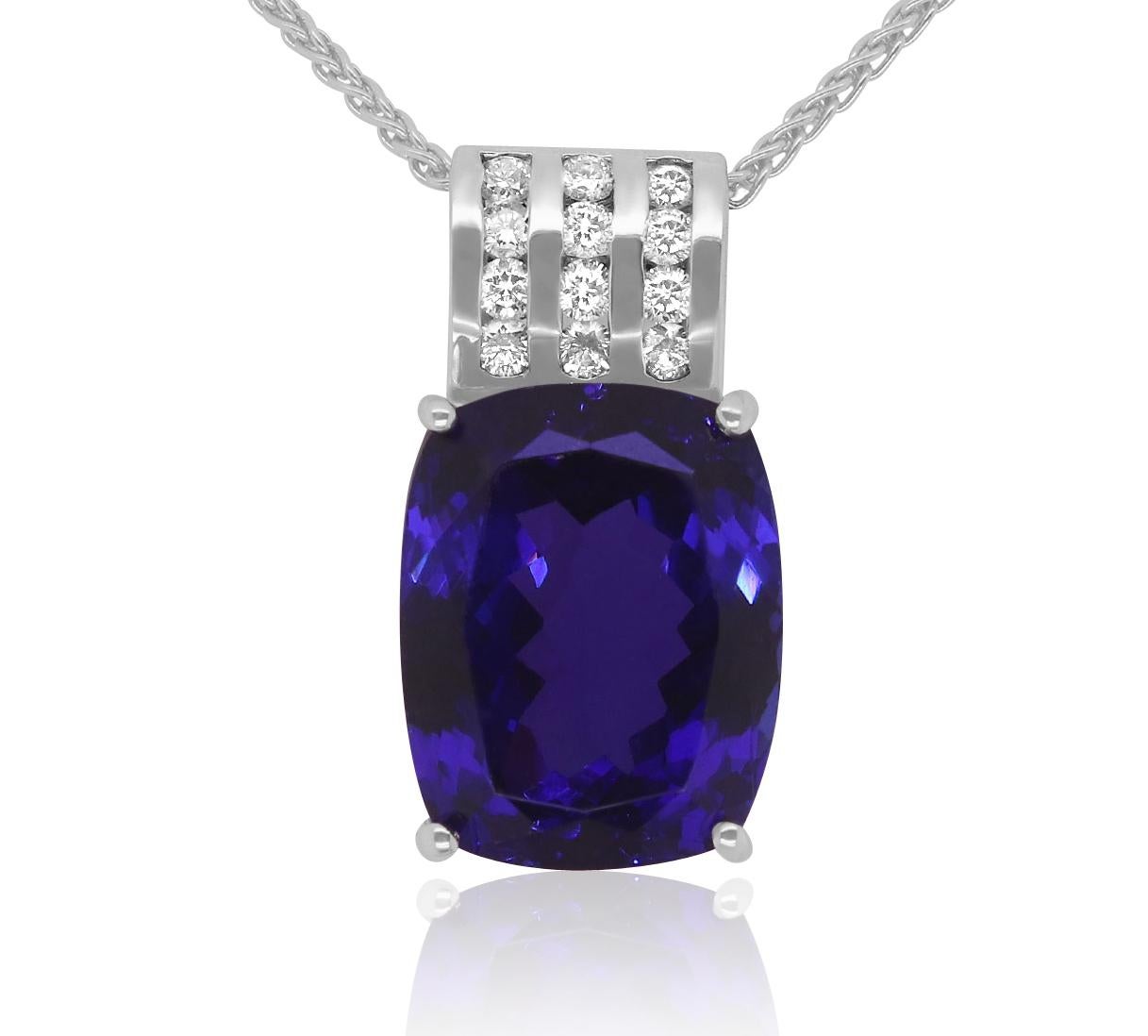 18k White Gold
Center Stone: 1 Cushion Cut Tanzanite at 25.70 Carats- Measuring 18.5 x 14.5mm
Diamonds: 12 Brilliant White Round Diamonds at 0.60  Carats - Color: HI - Clarity: VS-SI

Fine one-of-a-kind craftsmanship meets incredible quality in this