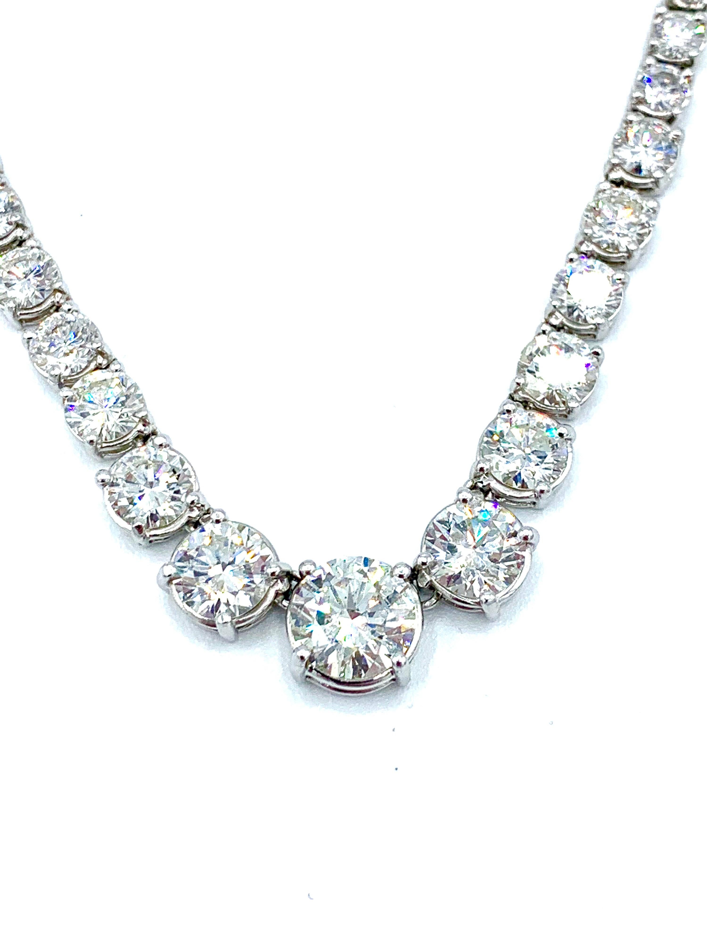 A stunning 25.70 carat Diamond riviera necklace in platinum.  The necklace consists of 83 round brilliant cut Diamonds, each set in a four prong basket with a hidden clasp and safety feature.  The necklace graduates from back to front, with the