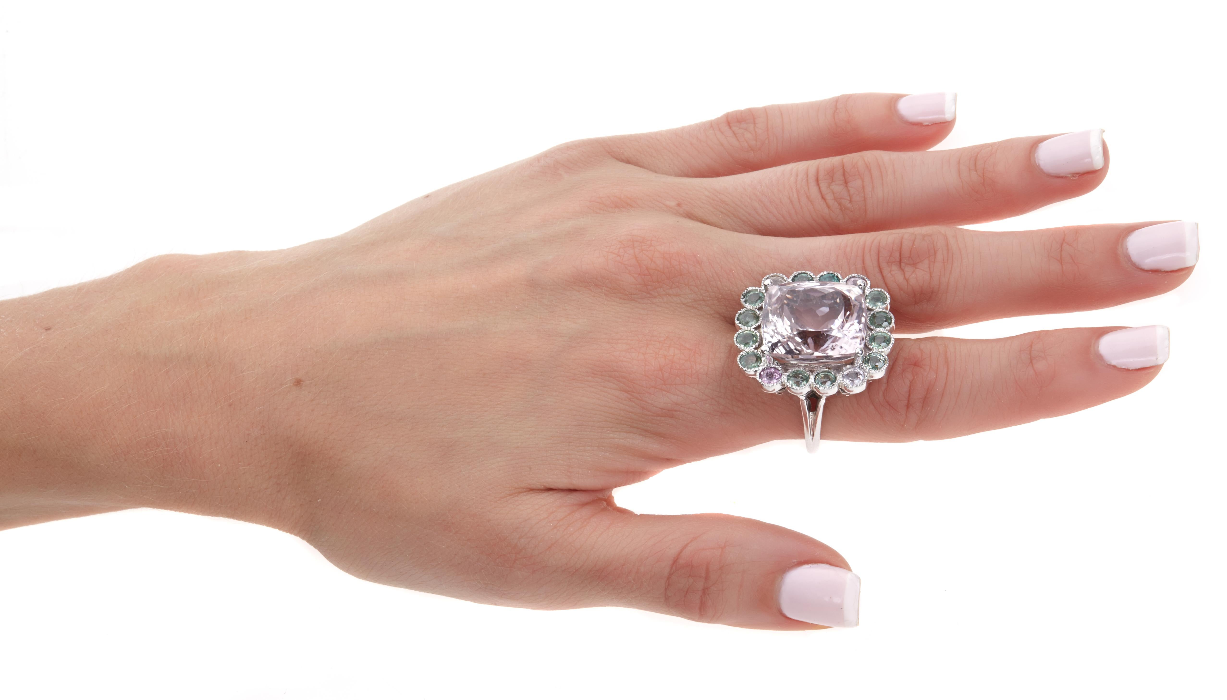 Sabrina Balsky Jewelry
One Of a Kind Unheated Kunzite Cocktail ring surrounded with Pink and Green Sapphires and Millgraining Detail around Sapphires set in Rhodium Plated 10K White Gold.  Shank has signature detailing.