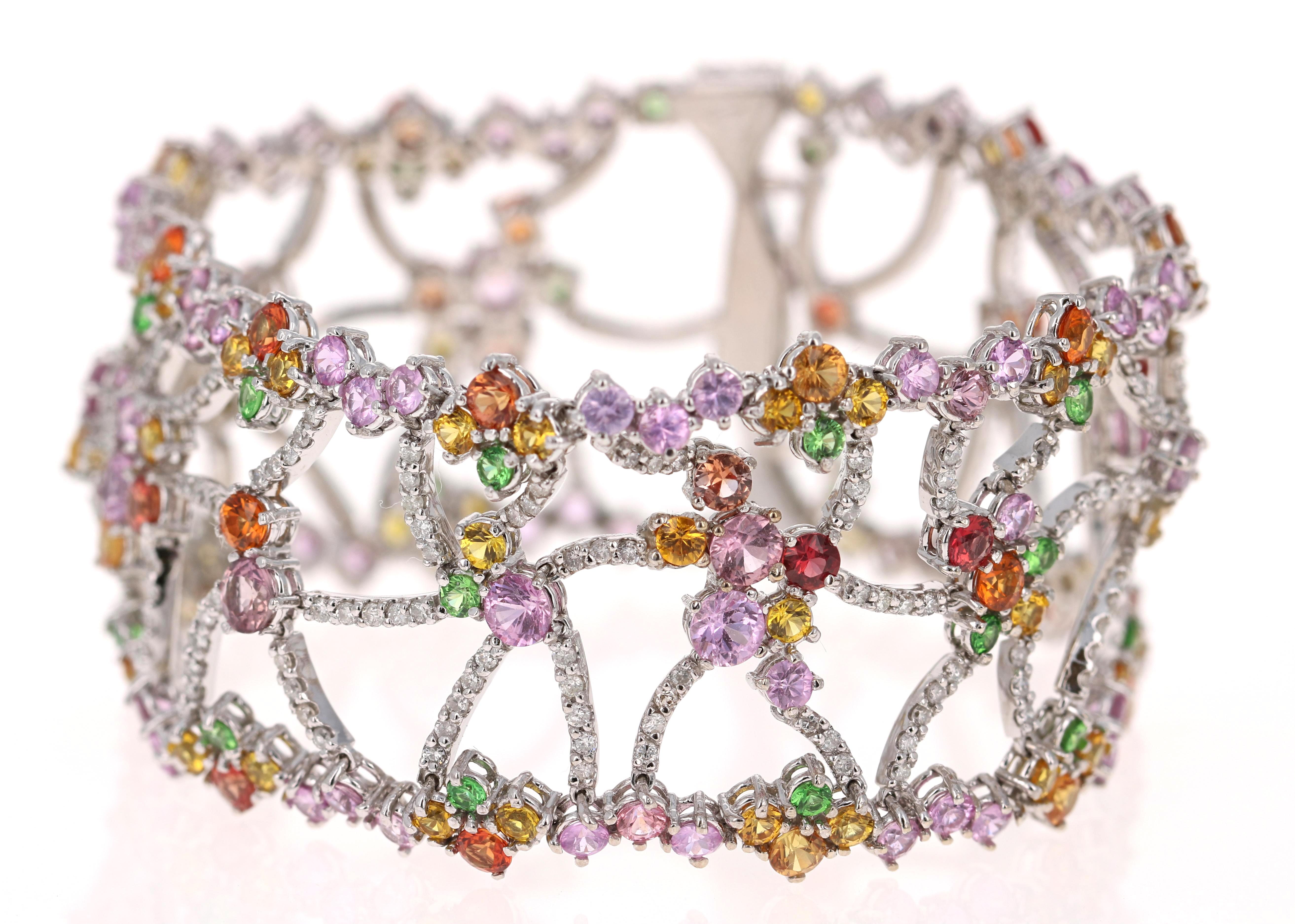 Stunning Multicolor Sapphire, Tsavorite and Diamond White Gold Statement Bracelet 
This gorgeous piece has Natural Round Cut Diamonds that weigh 2.50 Carats with a Clarity of SI2 and Color of F.
Natural Sapphires that weigh 21.44 Carats
Natural