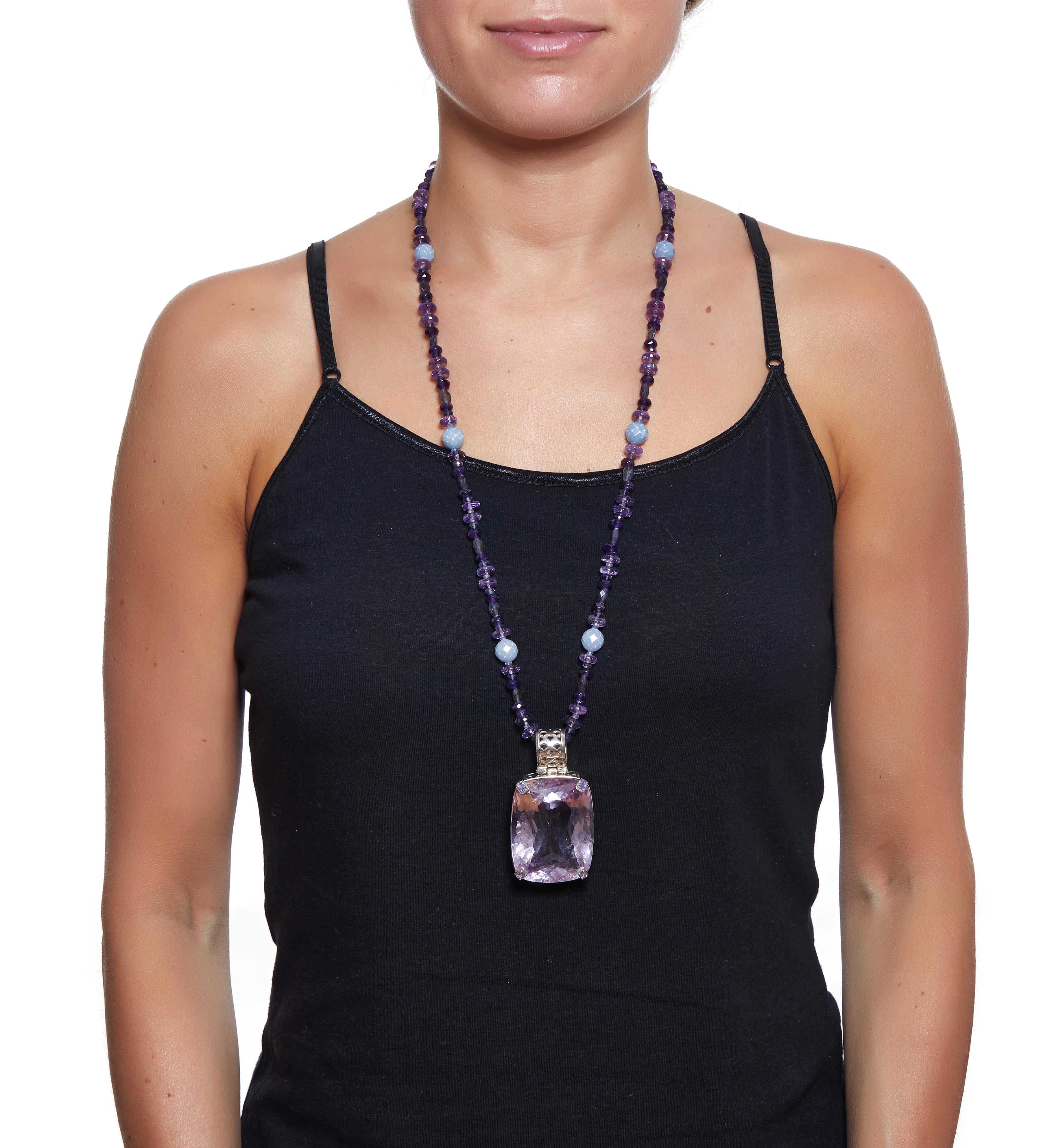 One of a Kind Handmade Pendant Necklace
Sabrina Balsky Jewelry
257.55 carats Natural Amethyst very clean stone set with Tanzanite set prong detail with signature design on bail and around stone.  Rhodium plated Sterling size of Pendant is 2-9/16