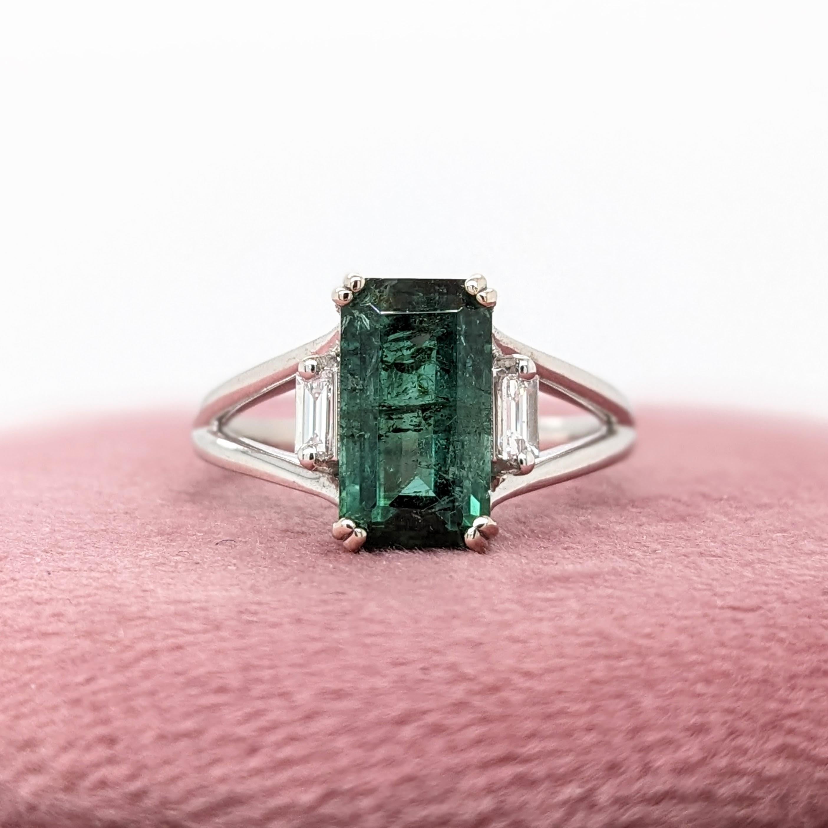 A vivid green tourmaline looks exquisite in this elegant minimalist ring with 2 cute diamond accents. A statement ring design perfect for an eye catching engagement or anniversary. This ring also makes a beautiful October birthstone ring for your
