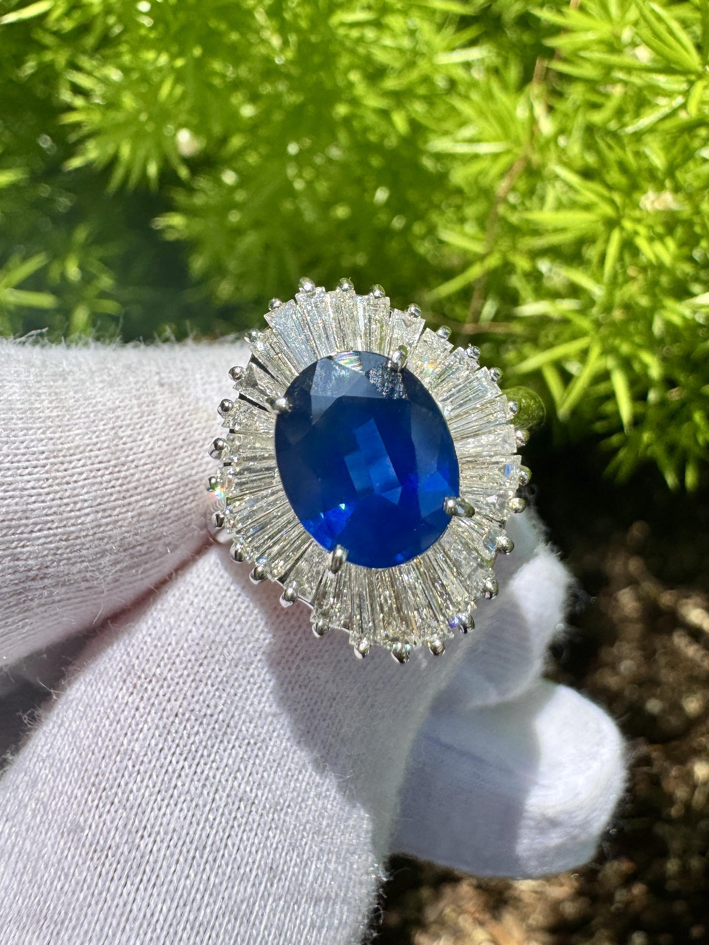Blue Sapphire and Diamond Halo Platinum Ballerina Ring. 

Inspired by the shape of a ballerina tutu, this ballerina ring features a natural oval-cut blue sapphire center stone. The sapphire carries a weight of 2.58 carats and offers excellent