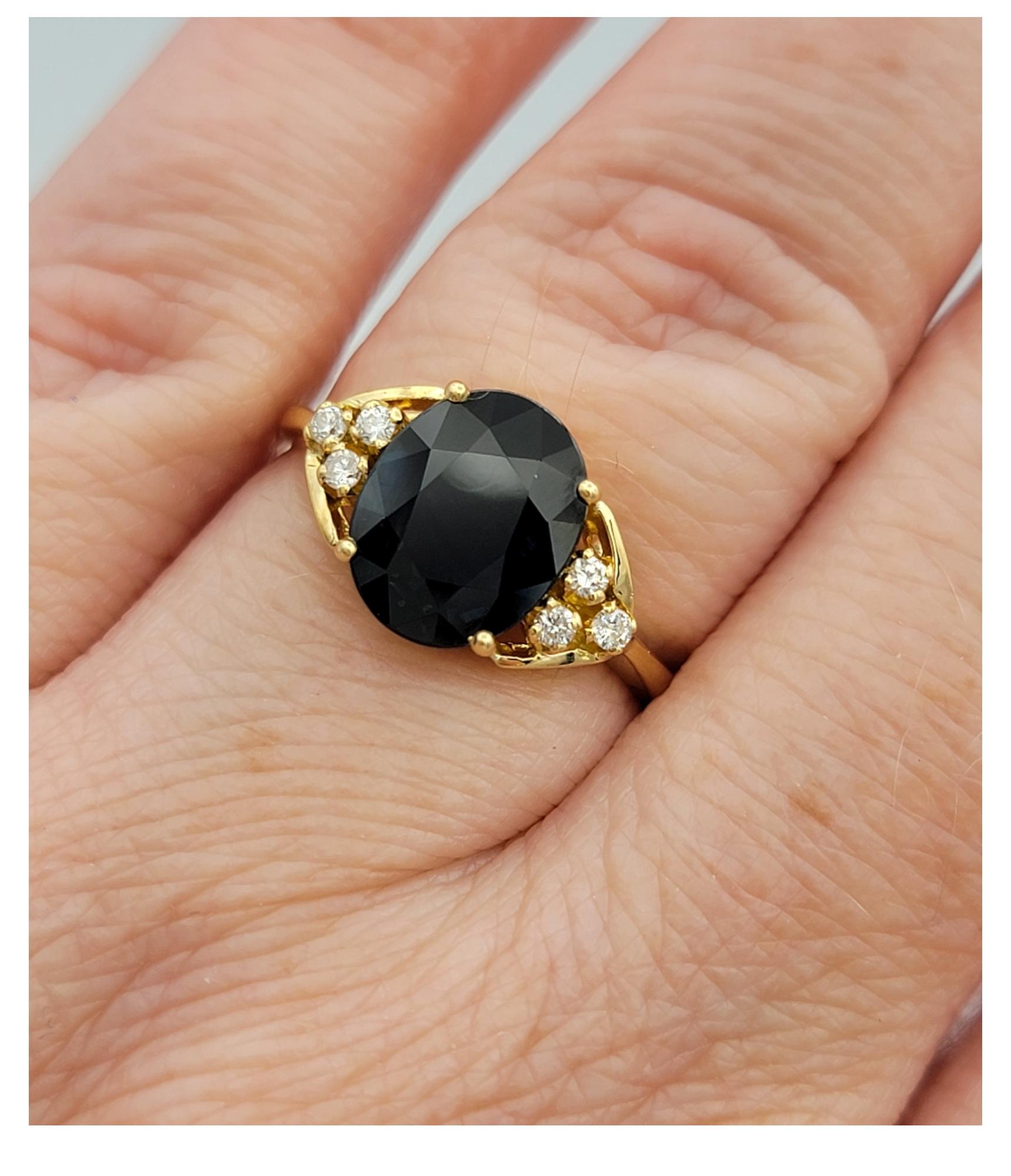 2.58 Carat Oval Cut Blue Sapphire Ring with Diamonds in 18 Karat Yellow Gold For Sale 4