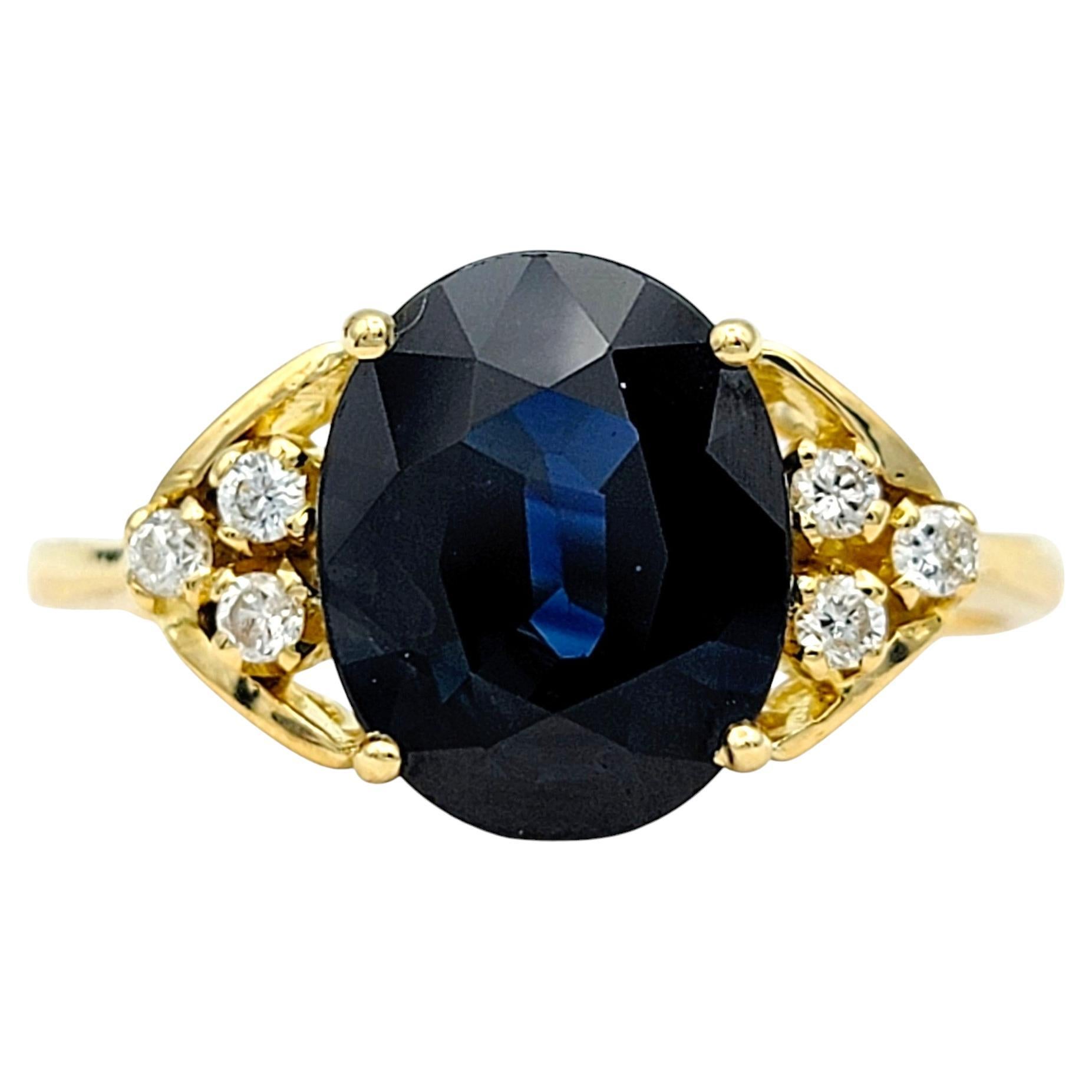 2.58 Carat Oval Cut Blue Sapphire Ring with Diamonds in 18 Karat Yellow Gold For Sale