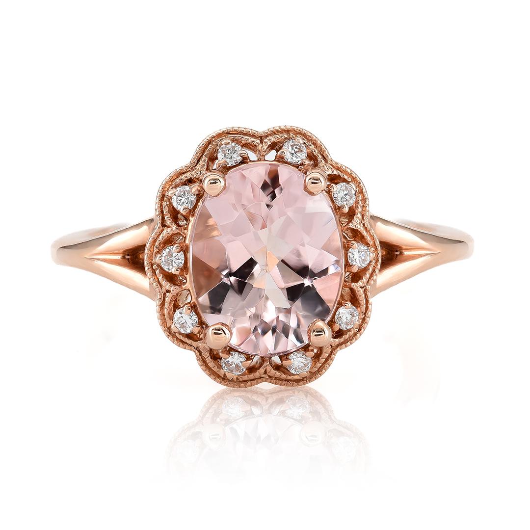 Delve into the exquisite beauty of this 14K rose gold ring featuring a striking 2.58 carat oval-cut natural Morganite accented with 0.10 carats of brilliant diamonds. The Morganite displays a captivating blend of pink and orange tones, radiating a