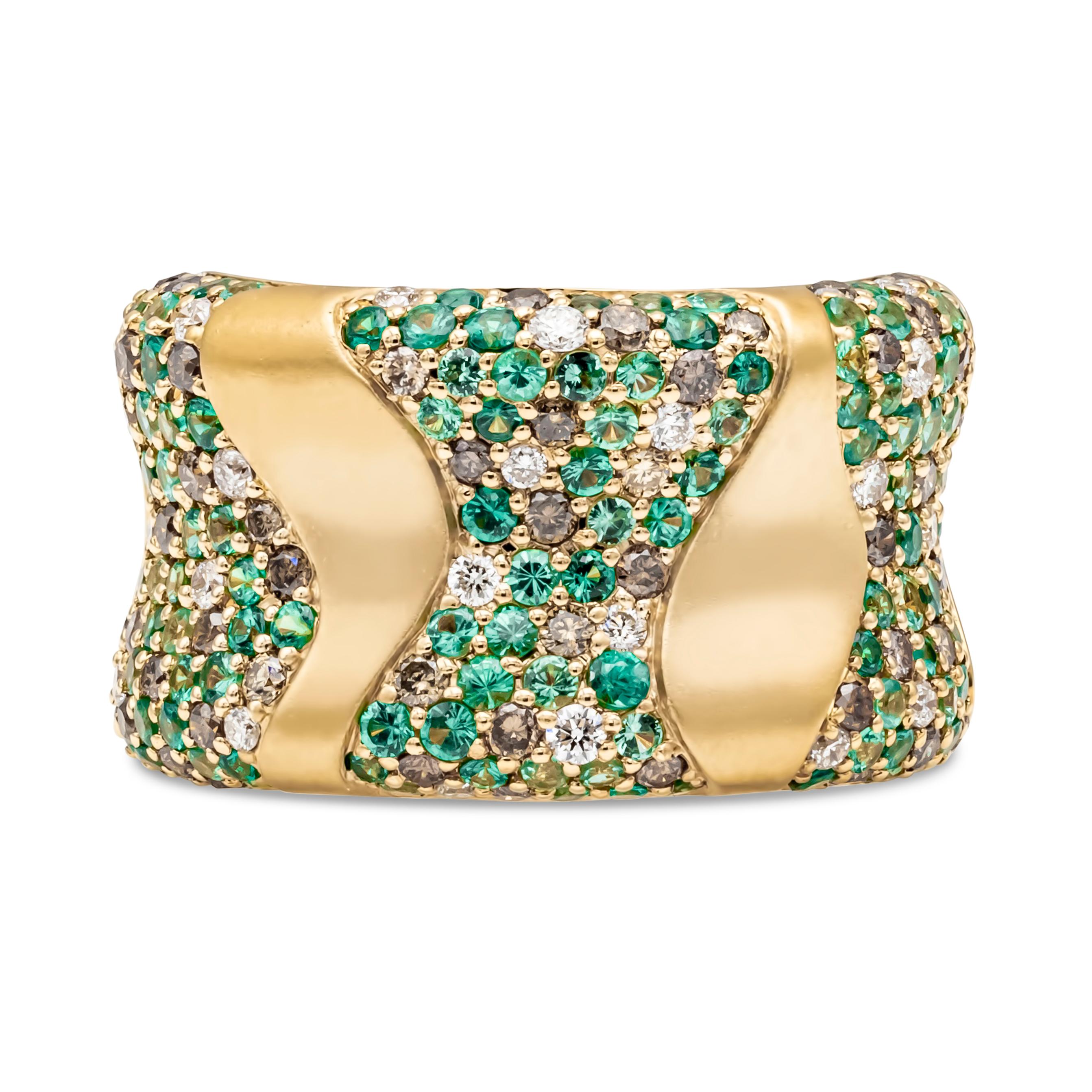 Showcasing an 18k yellow gold stylish and exquisite fashion ring accented with 1.61 carats total of round cut green tsavorite garnet, 0.66 carats total of round cut brown diamonds, VS-SI in clarity and 0.31 carats total of round white diamonds, H