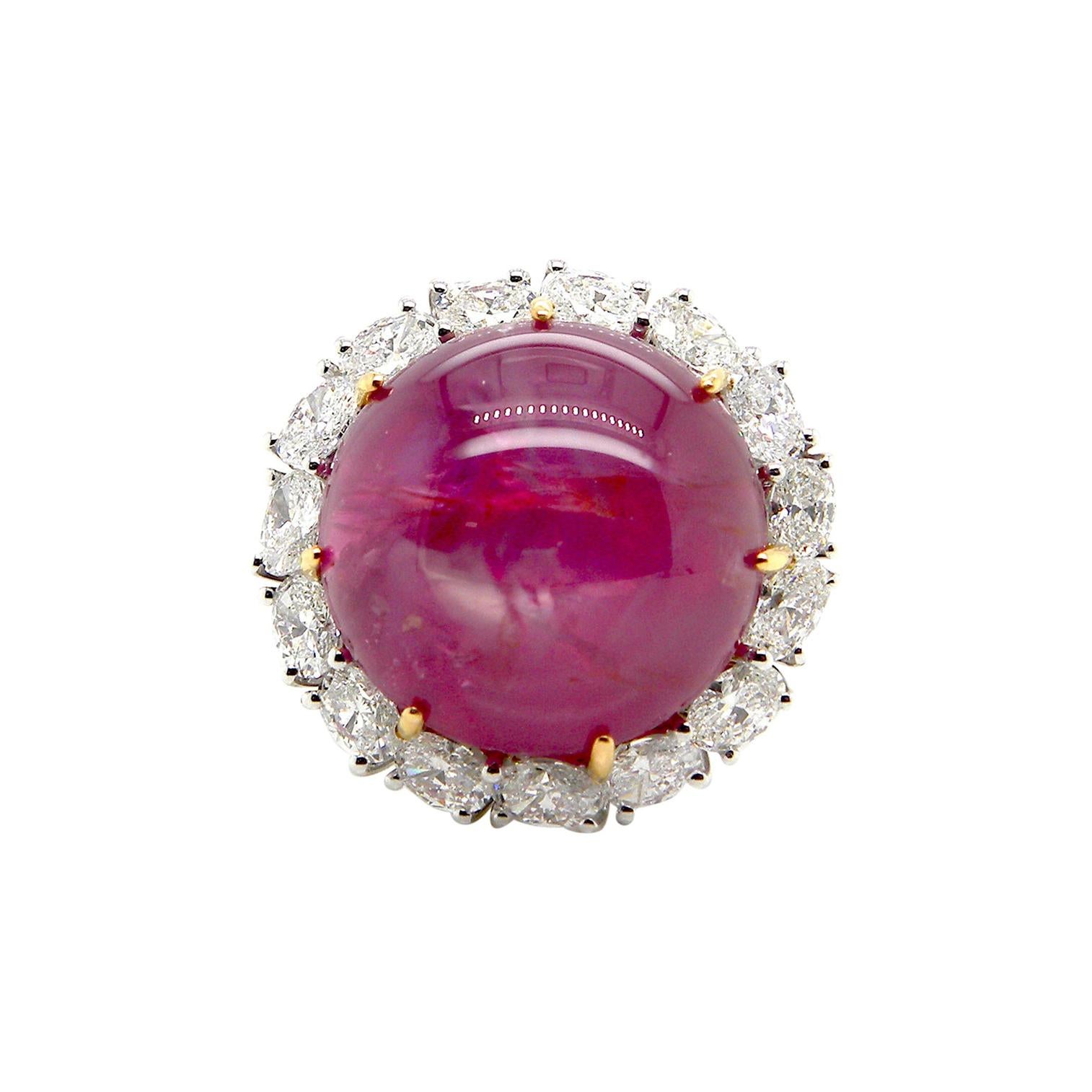 25.89 Carat GRS Certified Unheated Burmese Star Ruby and White Diamond Ring:

An extremely rare ring, it features an exquisite unheated Burmese red star ruby weighing 25.89 carat, with a halo of super white oval diamonds weighing a total of 1.6