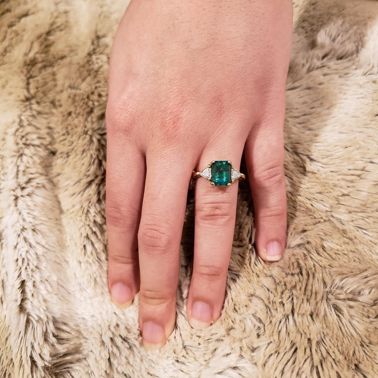 2.59 Carat Green Emerald and Trillion Diamond ThreeStone Engagement