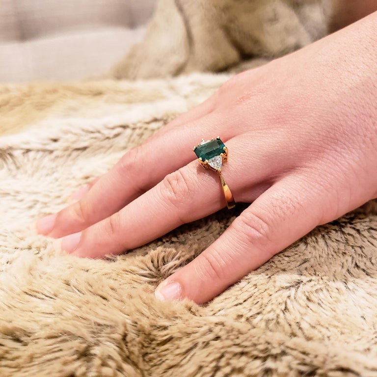 emerald diamond engagement emerald cut with trillion side stones