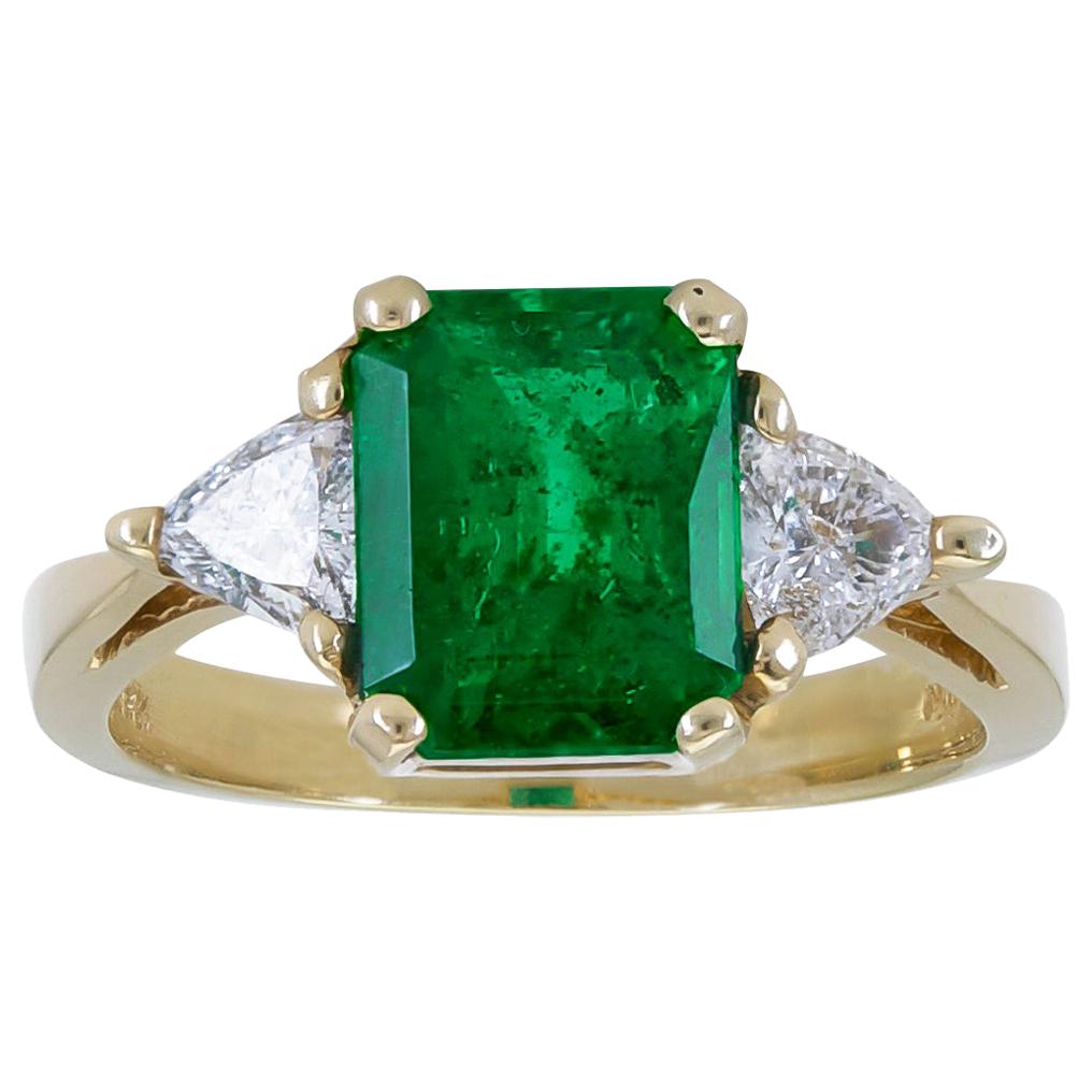 2.59 Carat Green Emerald and Trillion Diamond Three-Stone Engagement Ring For Sale