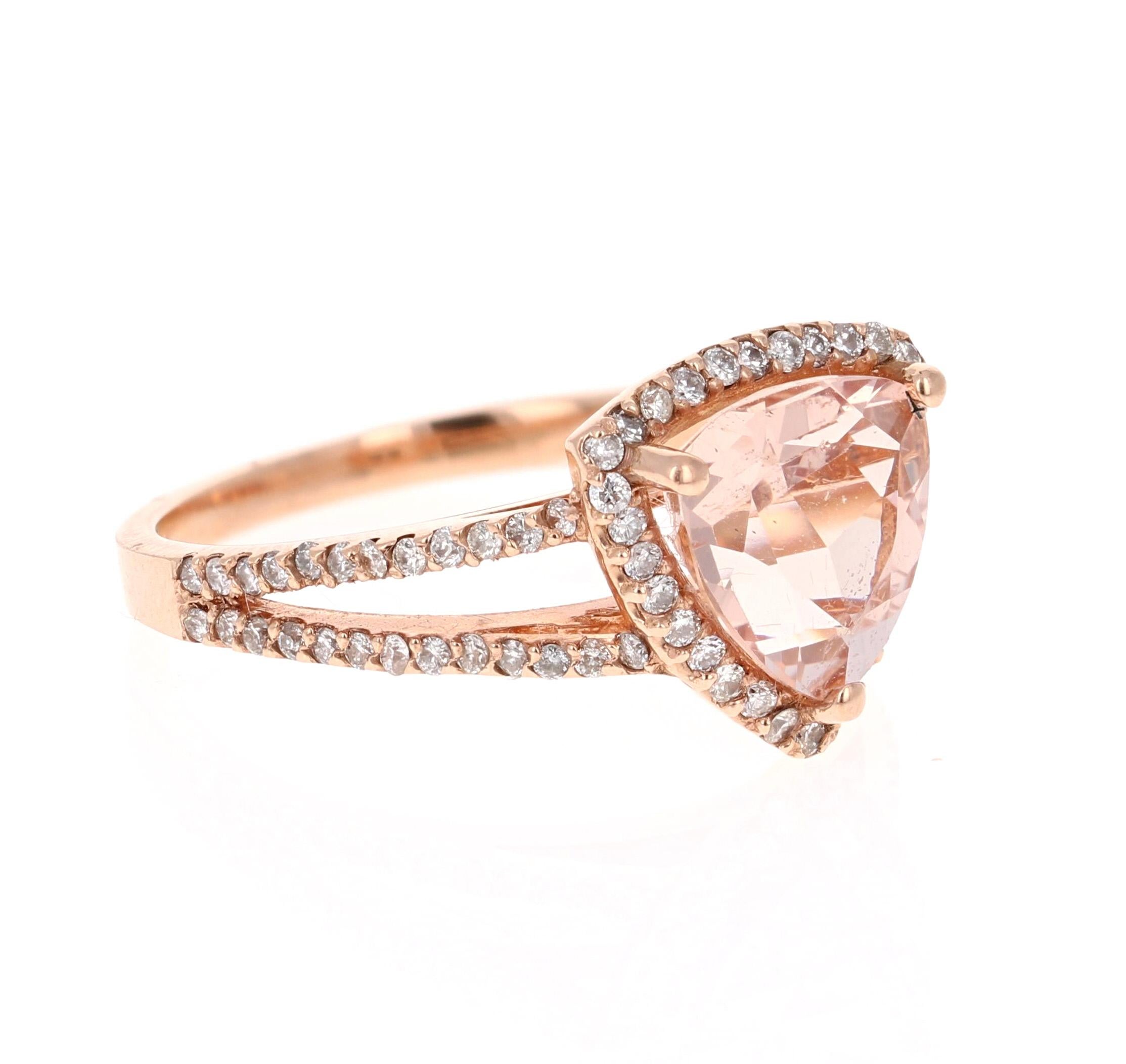 This Morganite ring has a 2.17 Carat Trillion Cut Morganite and is surrounded by 80 Round Cut Diamonds that weigh 0.42 Carats. The total carat weight of the ring is 2.59 Carats. The clarity and color of the natural diamonds are SI1-H. 

It is