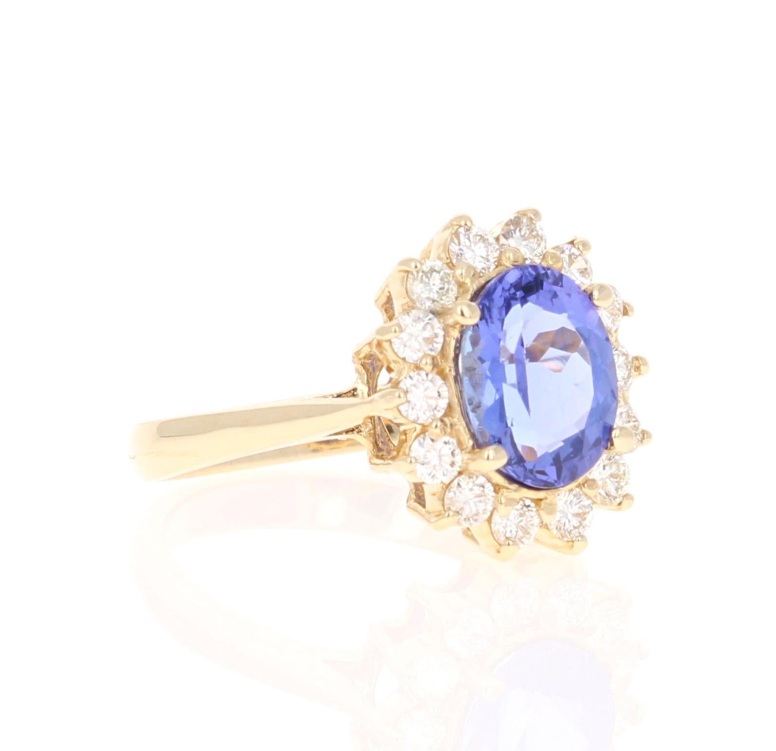 This ring has an Oval Cut Tanzanite that weighs 2.03 Carats and is adorned with 14 Round Cut Diamonds that weigh 0.56 Carats. The total carat weight of the ring is 2.59 Carats. (Clarity: VS, Color: H) The tanzanite measures at 7 mm x 9 mm (width x