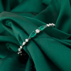 Bracciale rigido con smeraldo dello Zambia da 2,59 ct e diamanti naturali da 1,72 ct, in oro bianco 18 carati