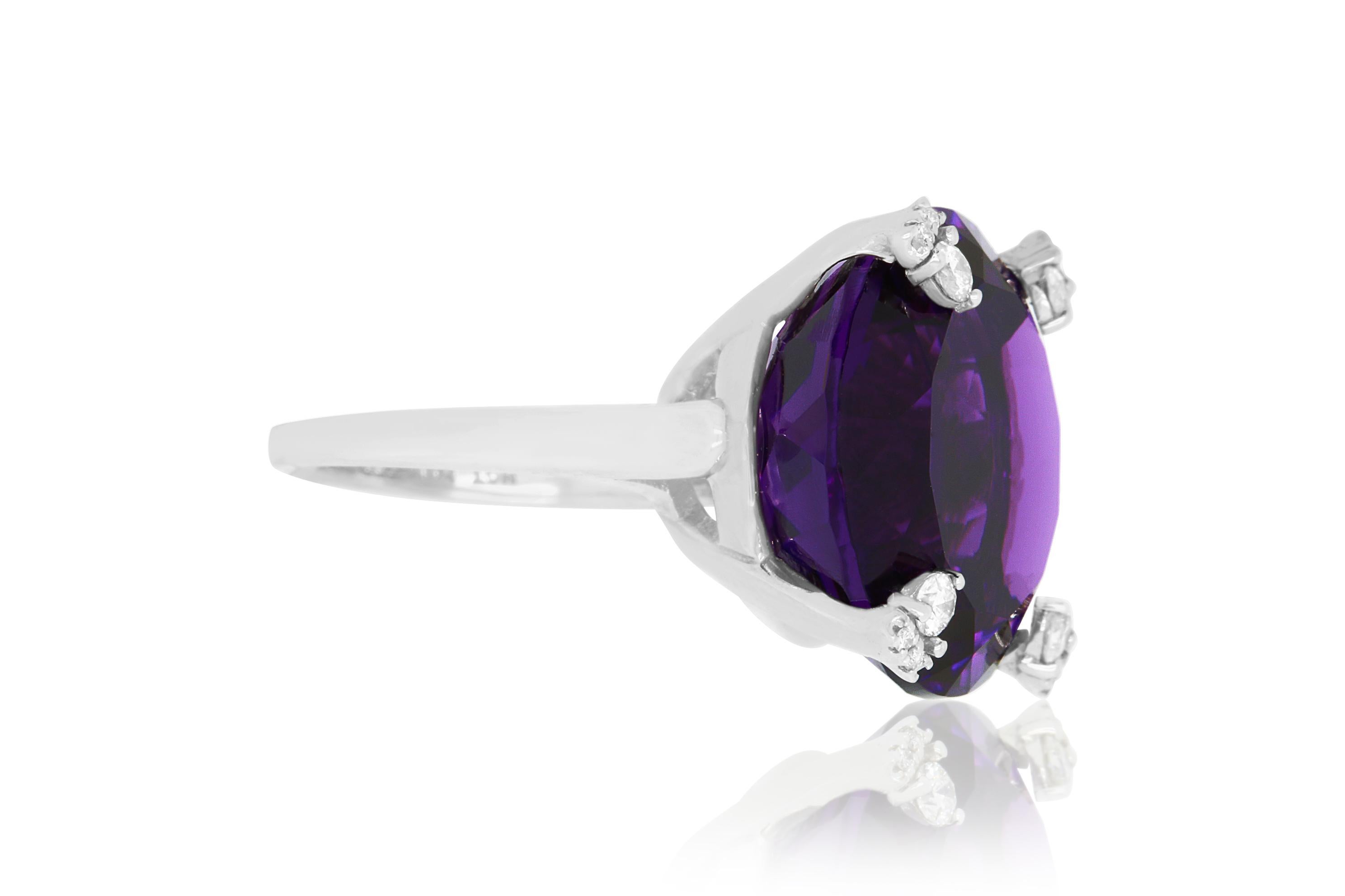 This beautiful and bold piece features a 25.93 Carat Round Amethyst stone encased in 14K white gold and adorned with a brilliant round white diamonds atop all prongs.

Material: 14k White Gold 
Stone Details: 1 Amethysts at 25.93 Carats
Mounting