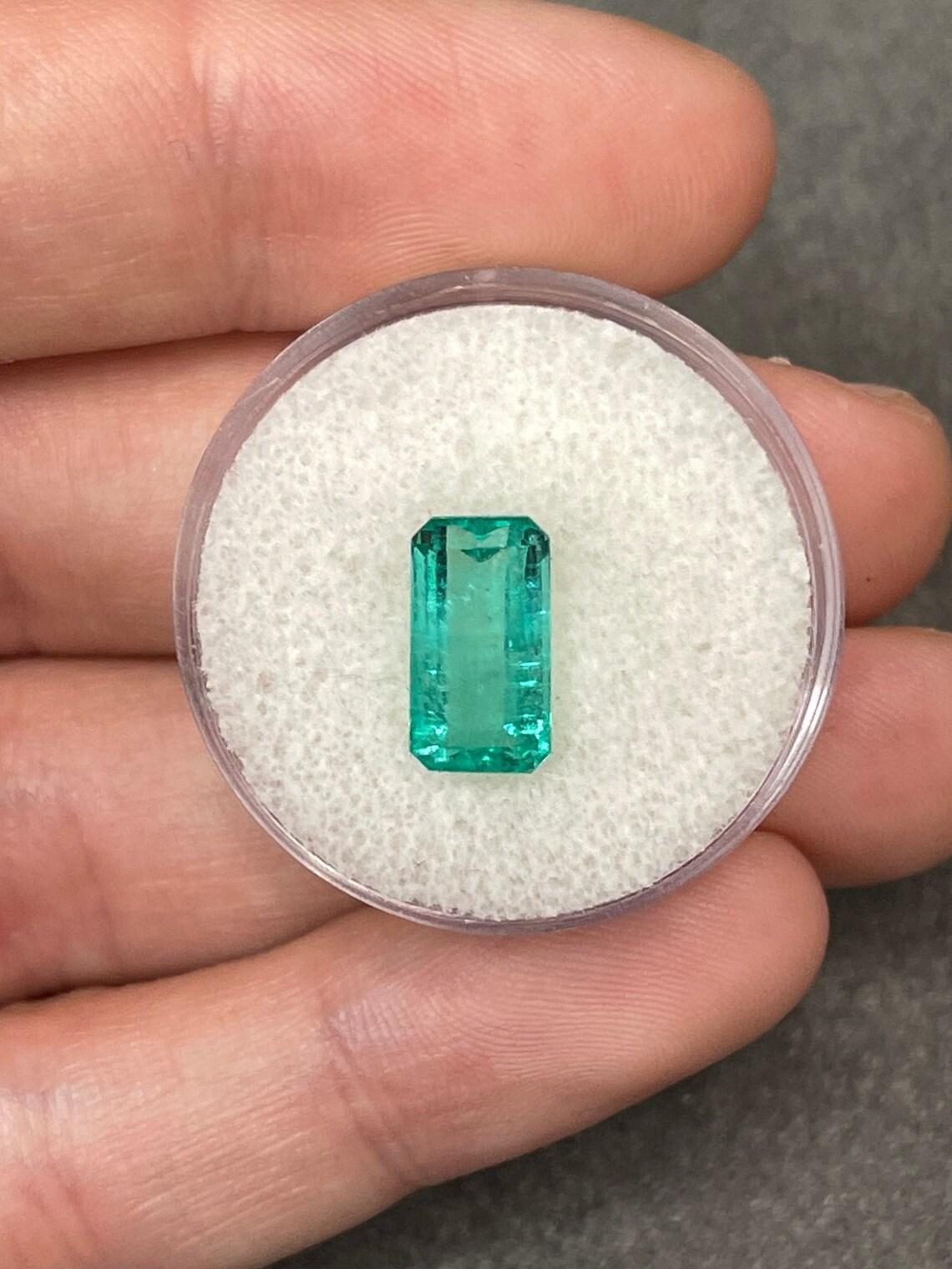 Stone: Emerald
Weight: 2.59-carats
Shape: Emerald Cut
Clarity: Transparent
Luster: Very Good
Color: Light Bluish Green
Measurements: 11.24mm x 6.08mm
Geographic Origin: Colombia
Treatment: Natural, Oiling

Comments: Due to their growth conditions in