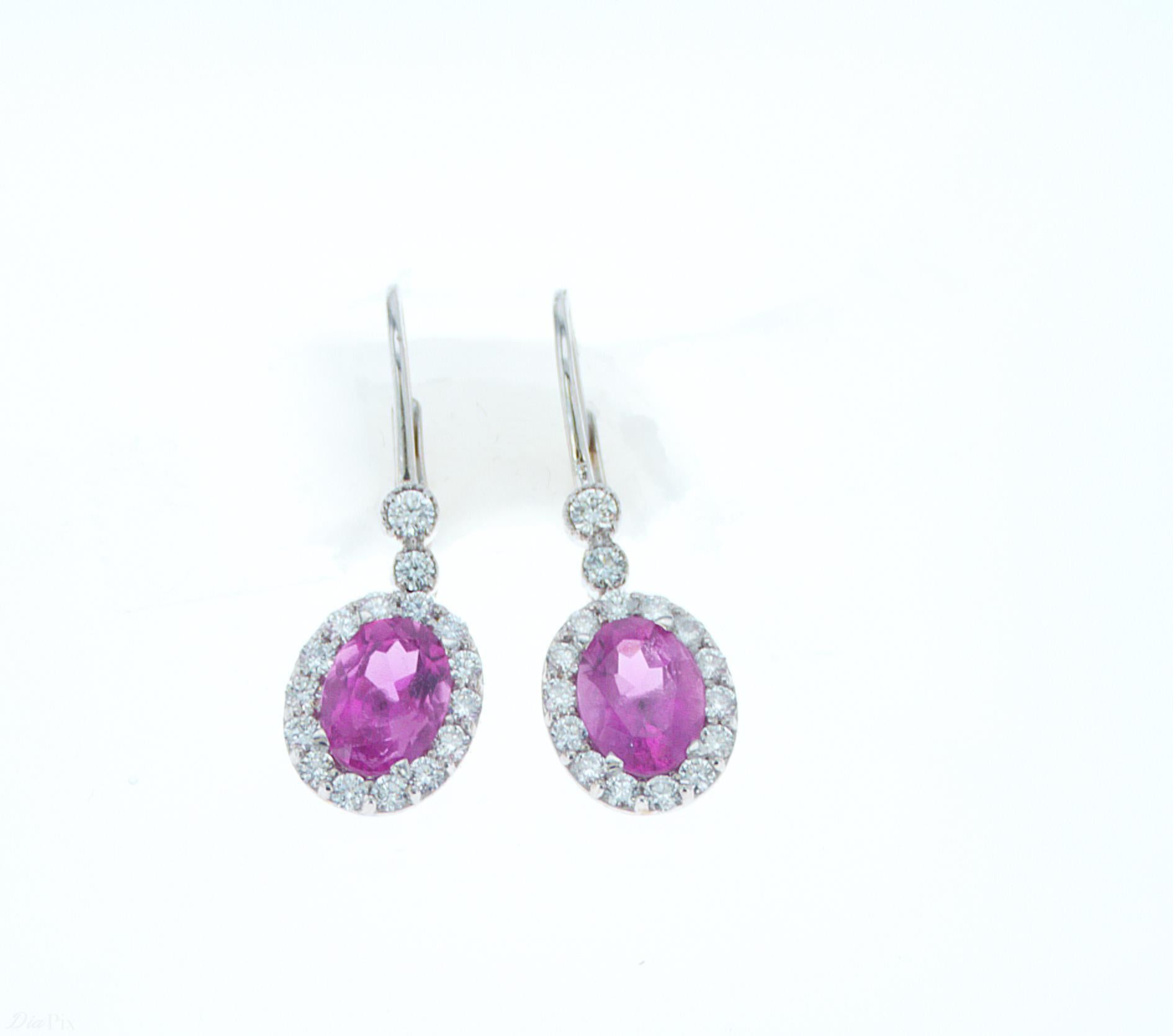 18k White Gold Earrings featuring 2.59ct TW of Oval Pink Tourmalines, and 0.77ct TW of Round Brilliant Diamonds.