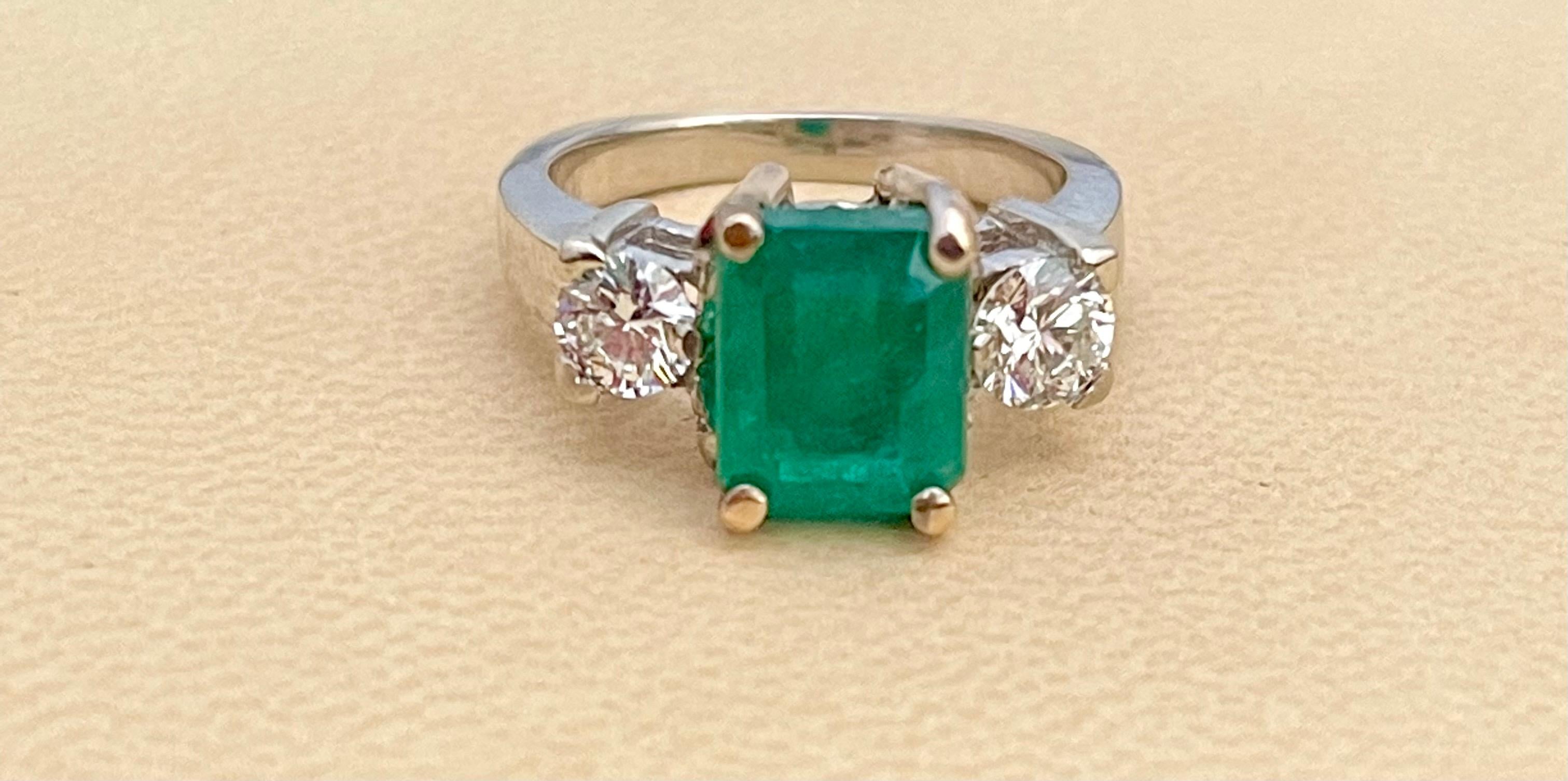 A classic,  ring 
 2.5  Carat Natural Emerald  Cut Emerald & Diamond Ring 14 Karat White Gold Size 6
Intense green color, Beautiful stone with shine and luster  but has small  inclusions as all natural emeralds have inclusions.  
They have black