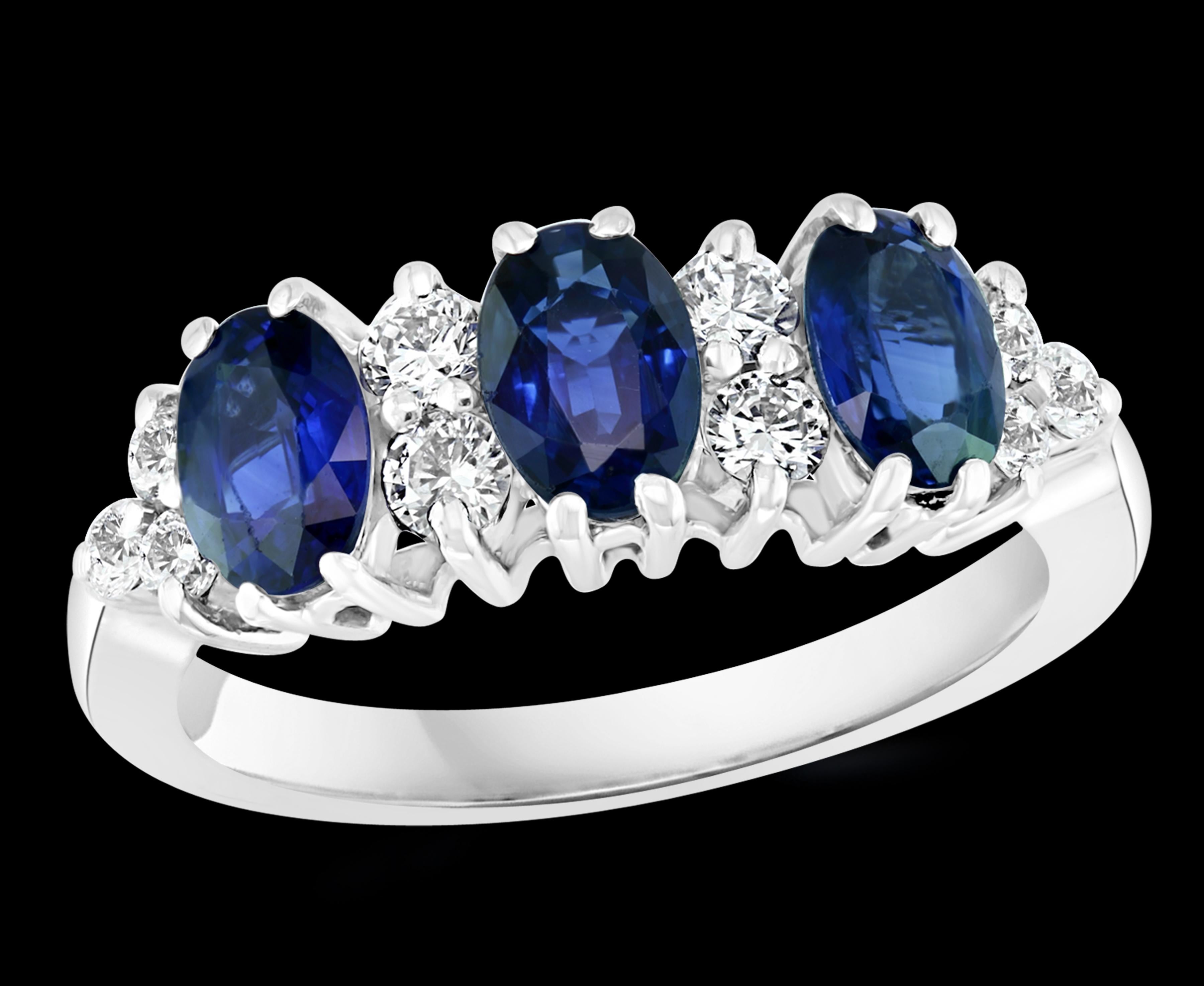 Approximately 2.5 Ct Blue Sapphire & 0.6 Ct Diamond Cocktail Ring in 18 Karat White Gold Estate
2.5 Carat of 3 Oval  blue Sapphire. This is an estate piece 
10 Round Brilliant cut diamond.    Total Diamond Weight of  brilliant  Round cut diamonds