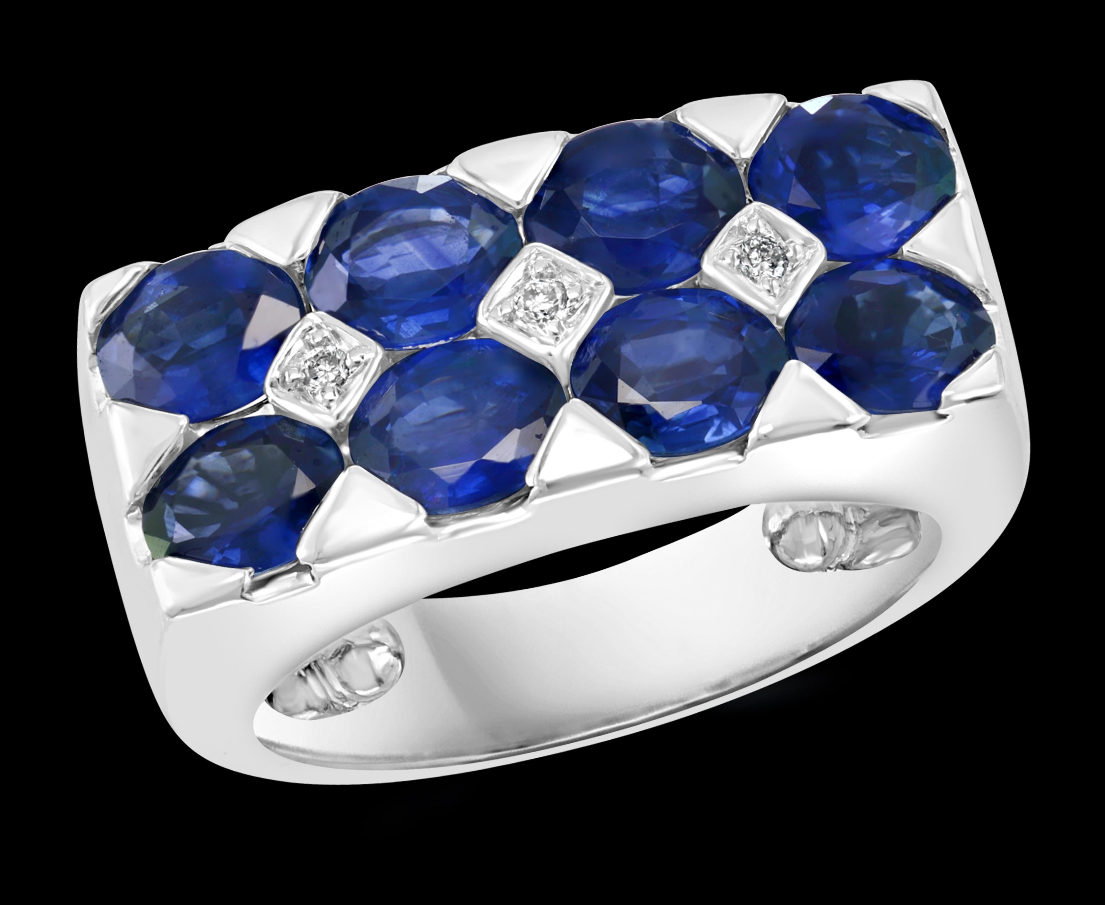 Approximately 2.5 Ct Blue Sapphire & Diamond Cocktail Ring in 18 Karat White Gold Estate
2.5 Carat of Oval  blue Sapphire. This is an estate piece 
3 Round Brilliant cut diamond.   
18 Karat White Gold 10.6 Grams 
Ring Size4 1/2 but it can be
