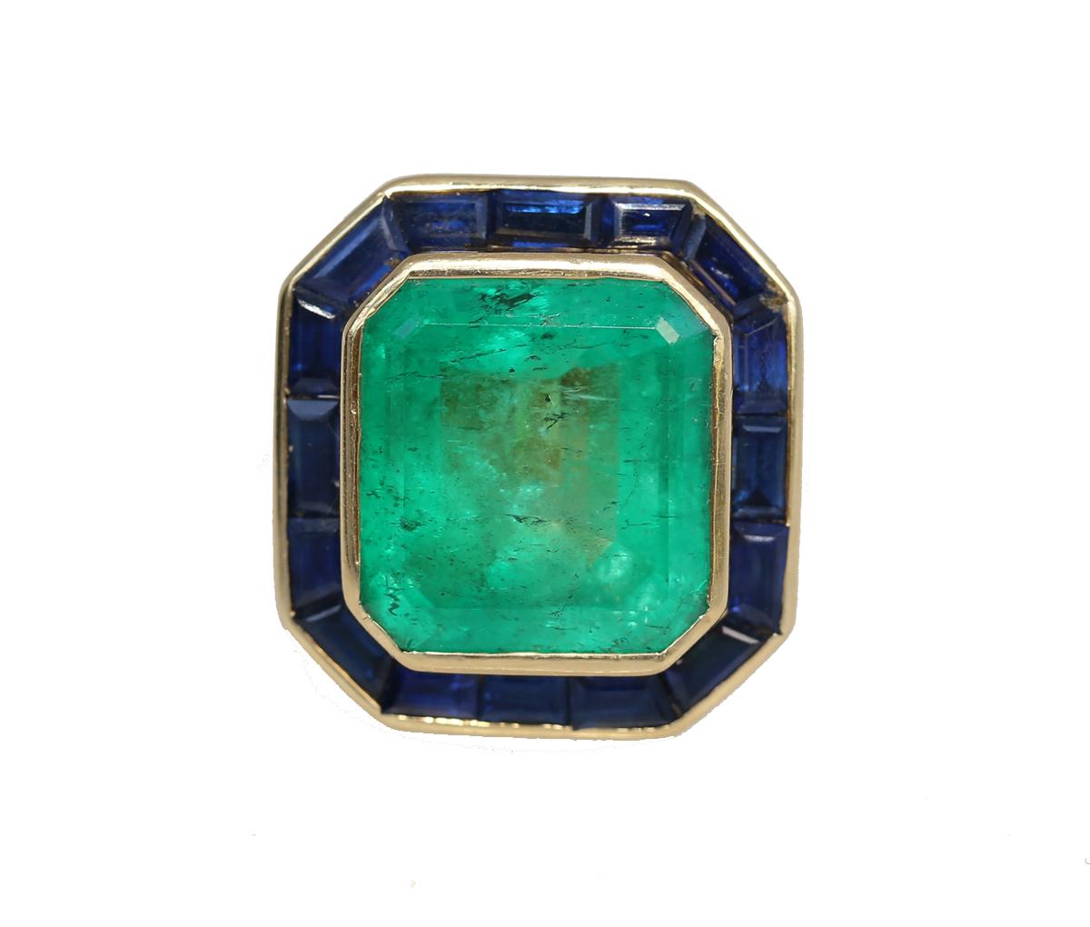 25 Carats Emerald Sapphires Yellow Gold Ring, 1950

25Ct of fine Emerald surrounded by Sapphires in a Yellow Gold casting. Magnificent and highly collectible ring. No picture can make this massive stone justice. Emerald has a deep, almost ancient