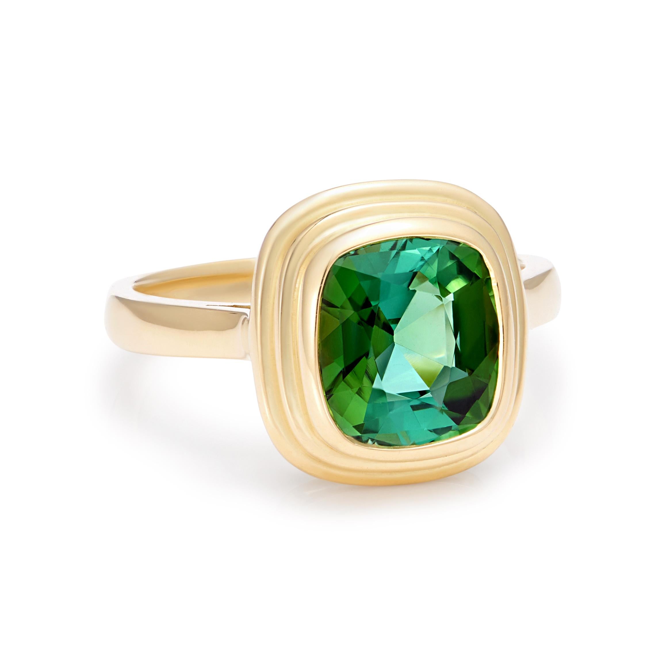 Stunning blue/green 2.5ct vivid Tourmaline set in 18kt yellow gold. This gem is a rare and unusual colour that really has a beautiful colour play, it has a superior cut, colour and clarity. 
Hand made in London, gemstone hand picked by London