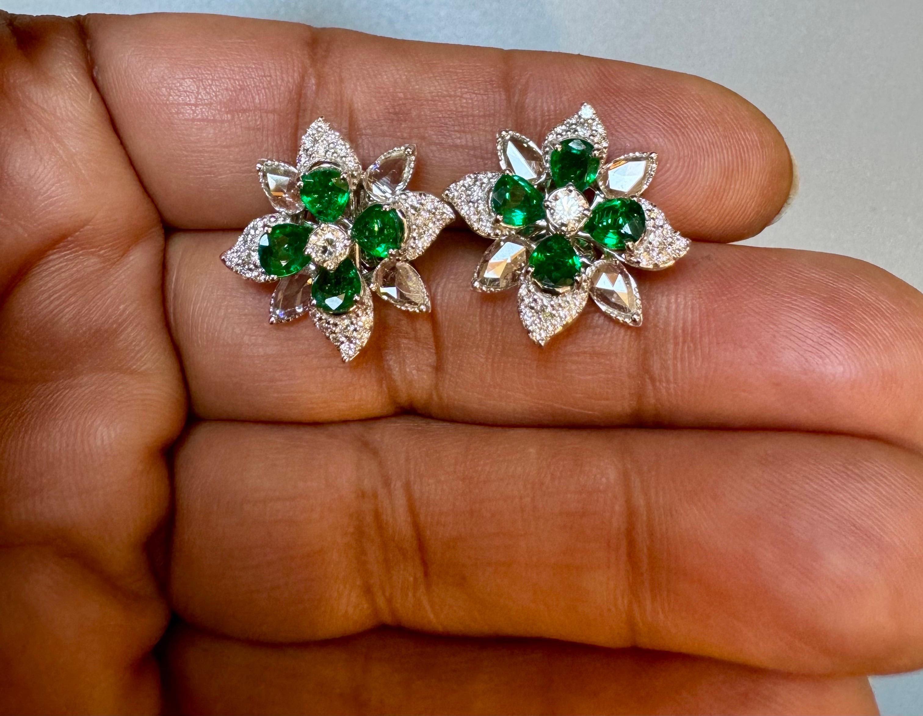 2.2Ct Natural Zambian Emerald  & 1.75 Ct Diamond & Rose cut Diamond Earring 18KG
 
This exquisite pair of earrings are beautifully crafted in 18 Karat white gold
Weight of 18 Karat gold is 10.3 Grams with emeralds.
8 Extreme fine pear shape