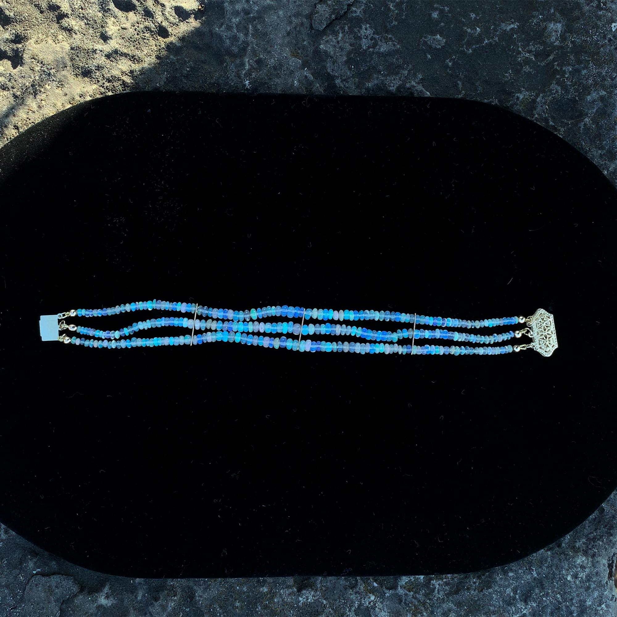 A three strand bracelet of natural earth mined Welo opal beads weighing about 25 carats. The bracelet measures 7