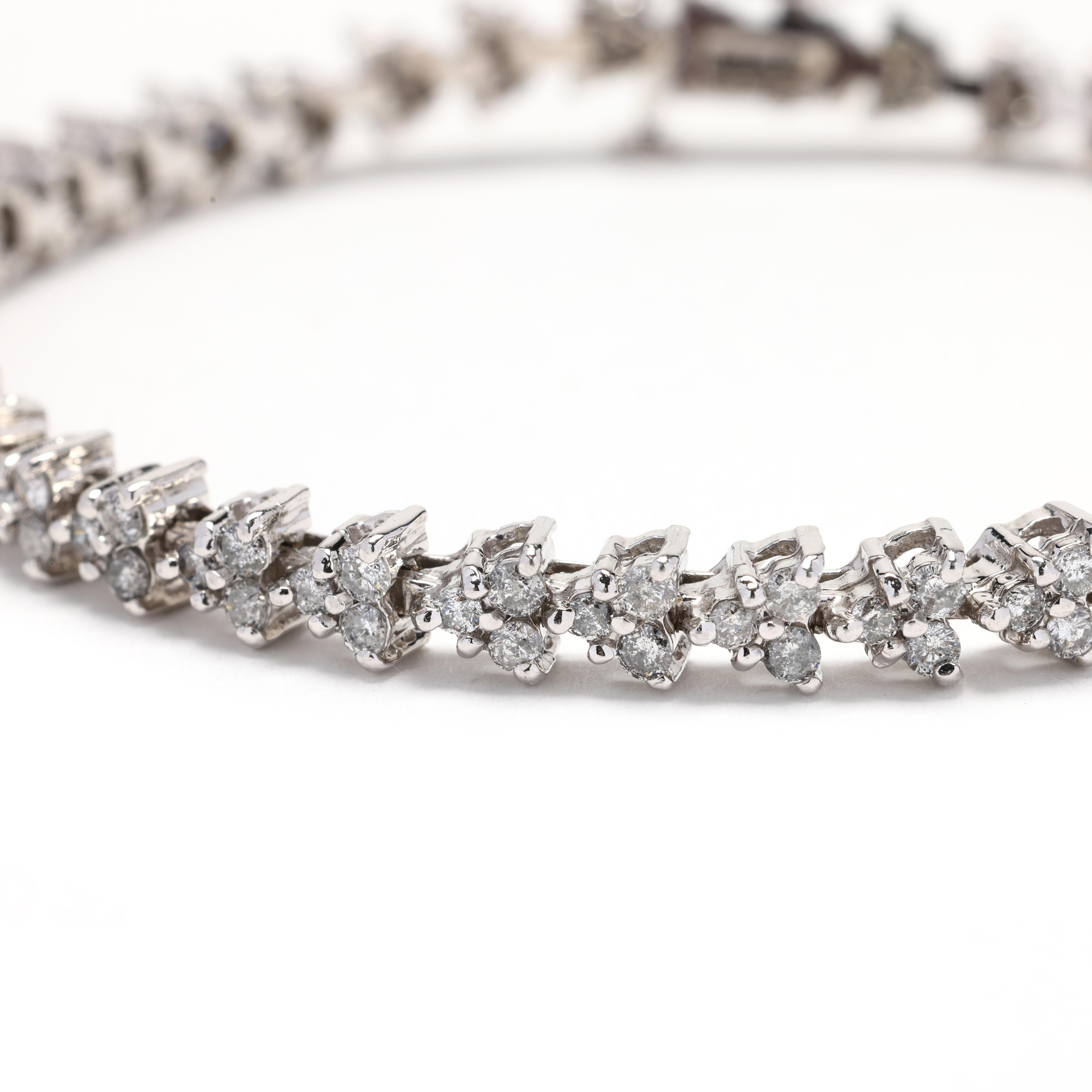 Elevate your wrist with the timeless elegance of this stunning 2.5ctw Diamond Tennis Bracelet. Expertly crafted in lustrous 14k white gold, this classic tennis bracelet features a dazzling array of round brilliant diamonds, creating a continuous