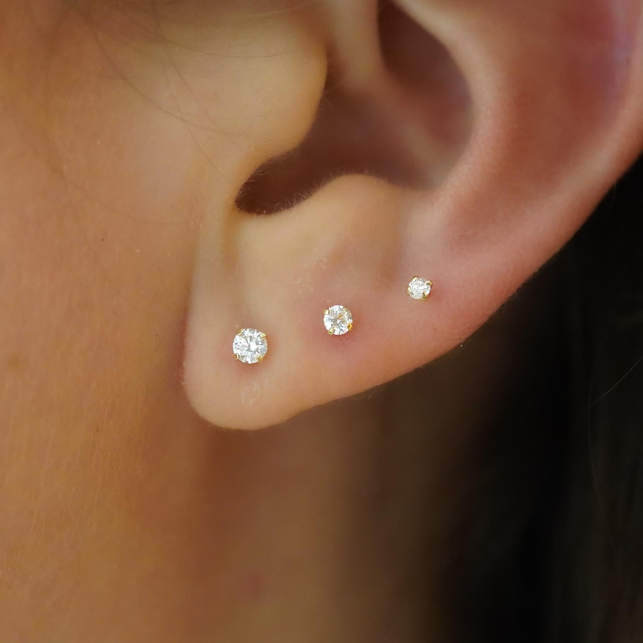 2.5mm Natural Diamond Round Cut Single Stud Earring In 14k Solid Yellow Gold. Sold as a single. Available in 2mm, 2.5mm, and 3mm. Ideal for earlobe, cartilage, helix, and tragus studs.

The diamonds are 100% natural, not lab grown, moissanite, or