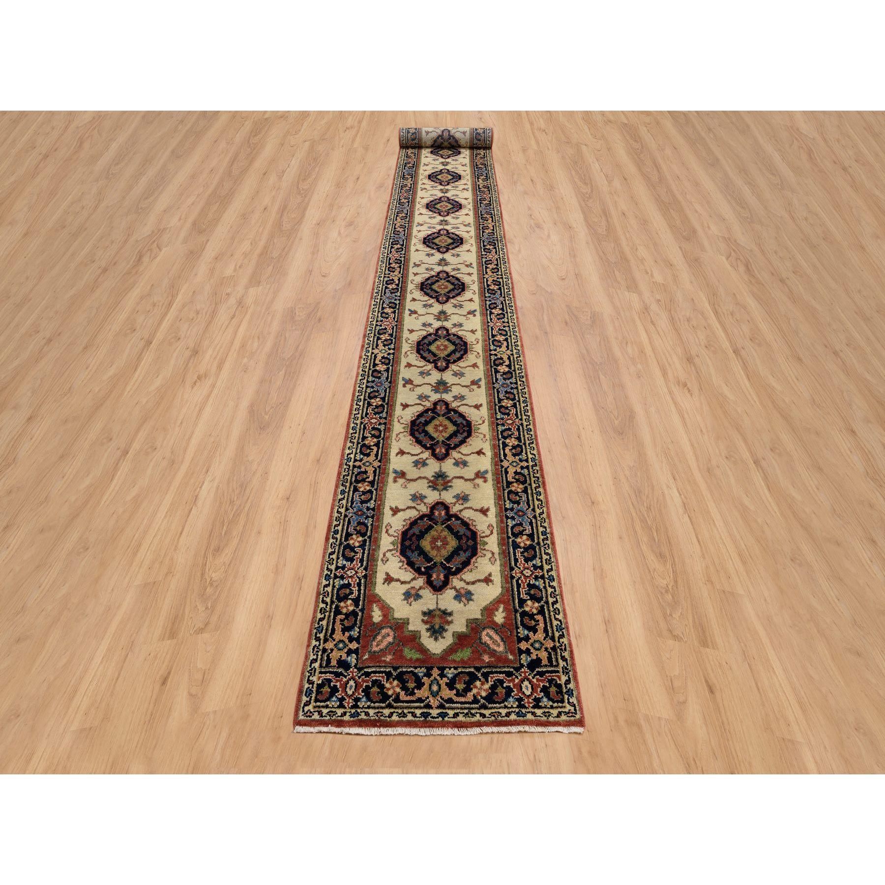 This is a truly genuine one-of-a-kind Ivory, Hand Knotted Heriz Revival with Medallions Design Pliable Wool, XL Runner Oriental Rug. It has been Knotted for months and months in the centuries-old weaving craftsmanship techniques by expert