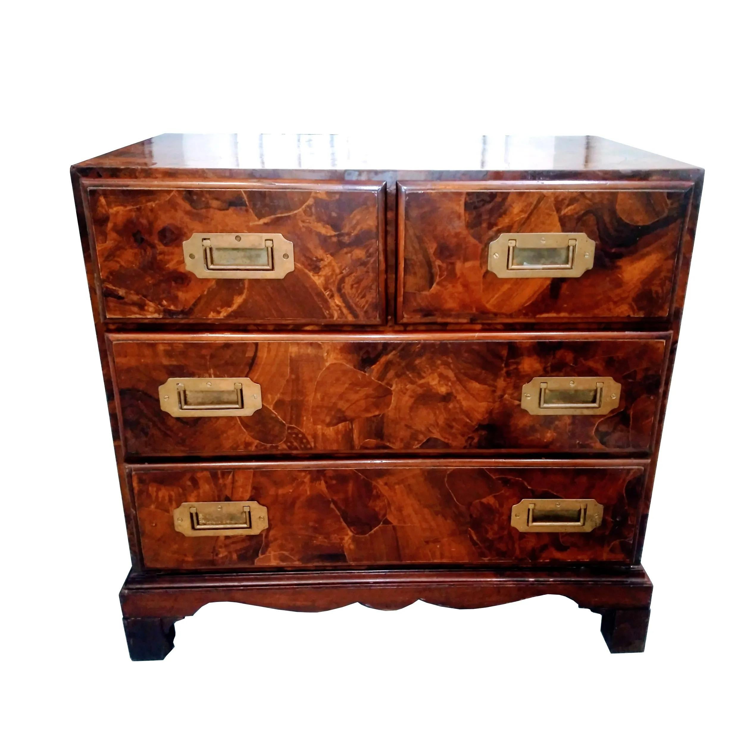 Vintage Burl Campaign Chest

Mid Century campaign dresser features rich burl resting on bracket feet.
Four drawers with recessed pulls.
