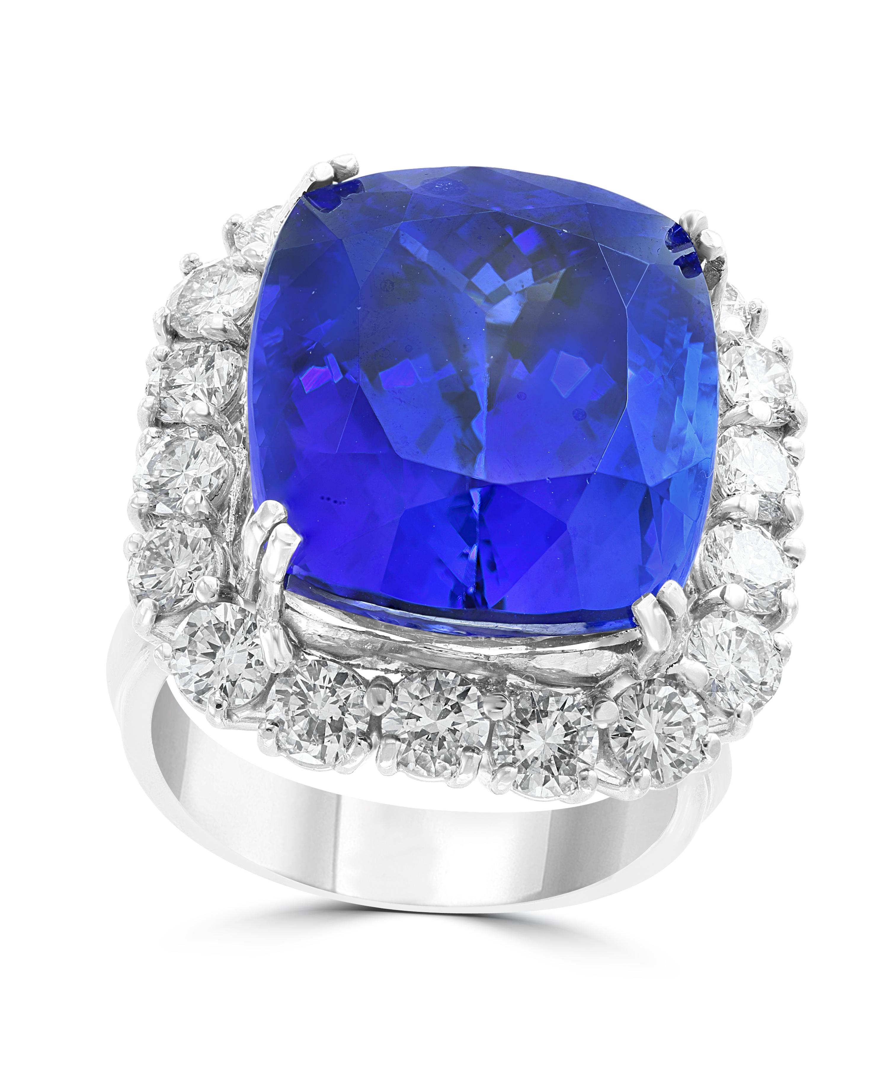 This extraordinary, 26.08 carat tanzanite is truly an extraordinary gemstone. There are  total  of 4.0 carats of shimmering white diamonds, this brilliant cushion-cut gem exhibits the rich violetish-blue color for which these stones are known and so