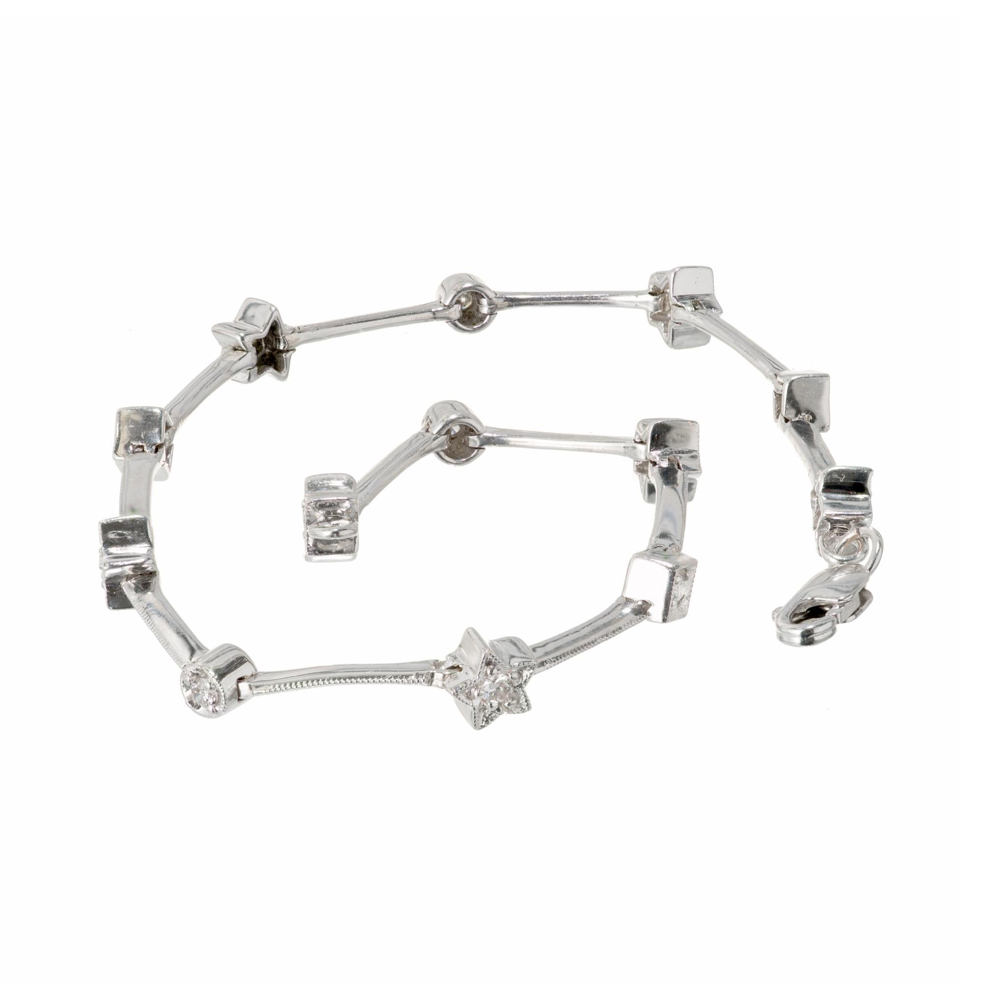 Star, circle and square diamond bracelet in 14k white gold with thin bars separating stars, circles and squares. 

13 round full cut diamonds, approx. total weight .26cts, H, SI1 
14k white gold 
Tested: 14k 
Stamped: 585 
5.8 grams 
Length: 7