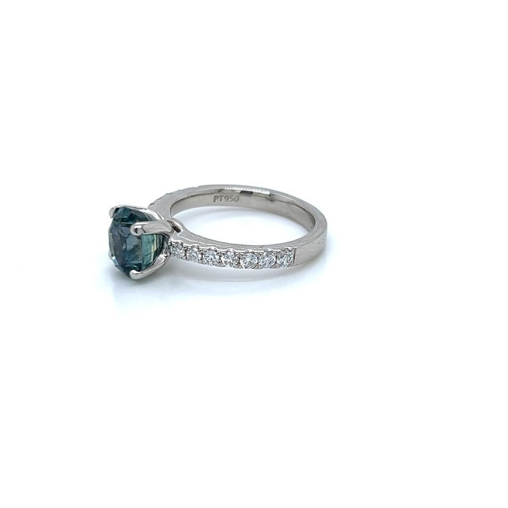 Oval Cut 2.6 Carat Oval Teal Sapphire and Diamond Ring in Platinum For Sale