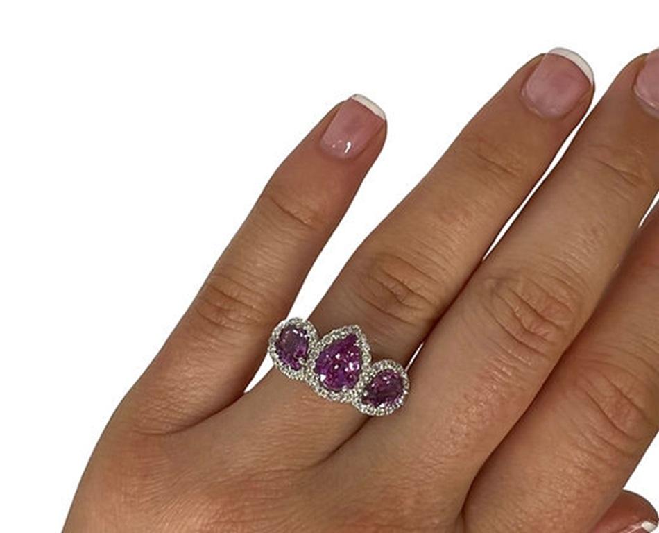 Sapphire Weight:2.62 CTs, Measurements: 8x6/7x5 mm, Diamond Weight: 0.47 CTs (1.3 mm), Metal: 18K White Gold, Gold Weight: 6.04 gm, Ring Size: 7, Shape: Pear, Color: Pink, Hardness: 9, Birthstone: September