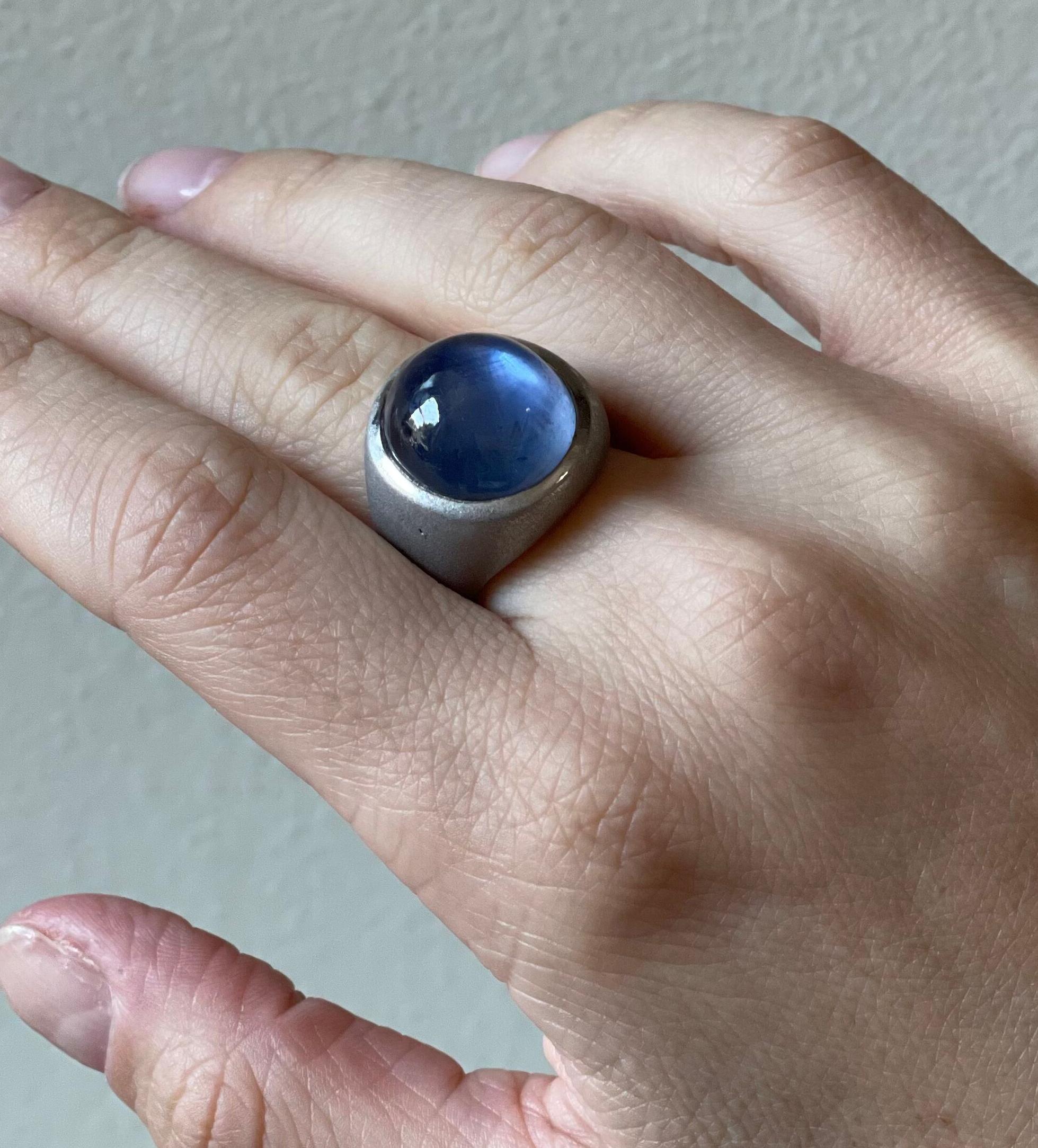 Large platinum brushed finish ring, set with center approx. 26 carat star sapphire cabochon (stone measures 16.2 x 15.5 x 9.5mm). Ring size 8.5, top of the ring is 0.75