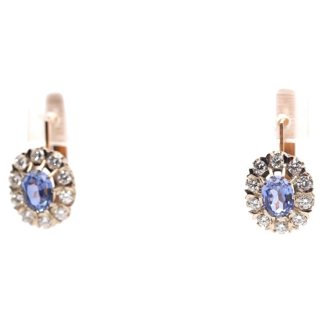 2.6 Ct Diamonds Sapphires Gold Earring 14K, 1960
Gold earrings inlaid with about 2.60 Carats of white Diamonds and Sapphires with delicate blue-violet colors. 
The earrings are stamped and signed 585 (14 Karat) Soviet Russian stamps. The height of